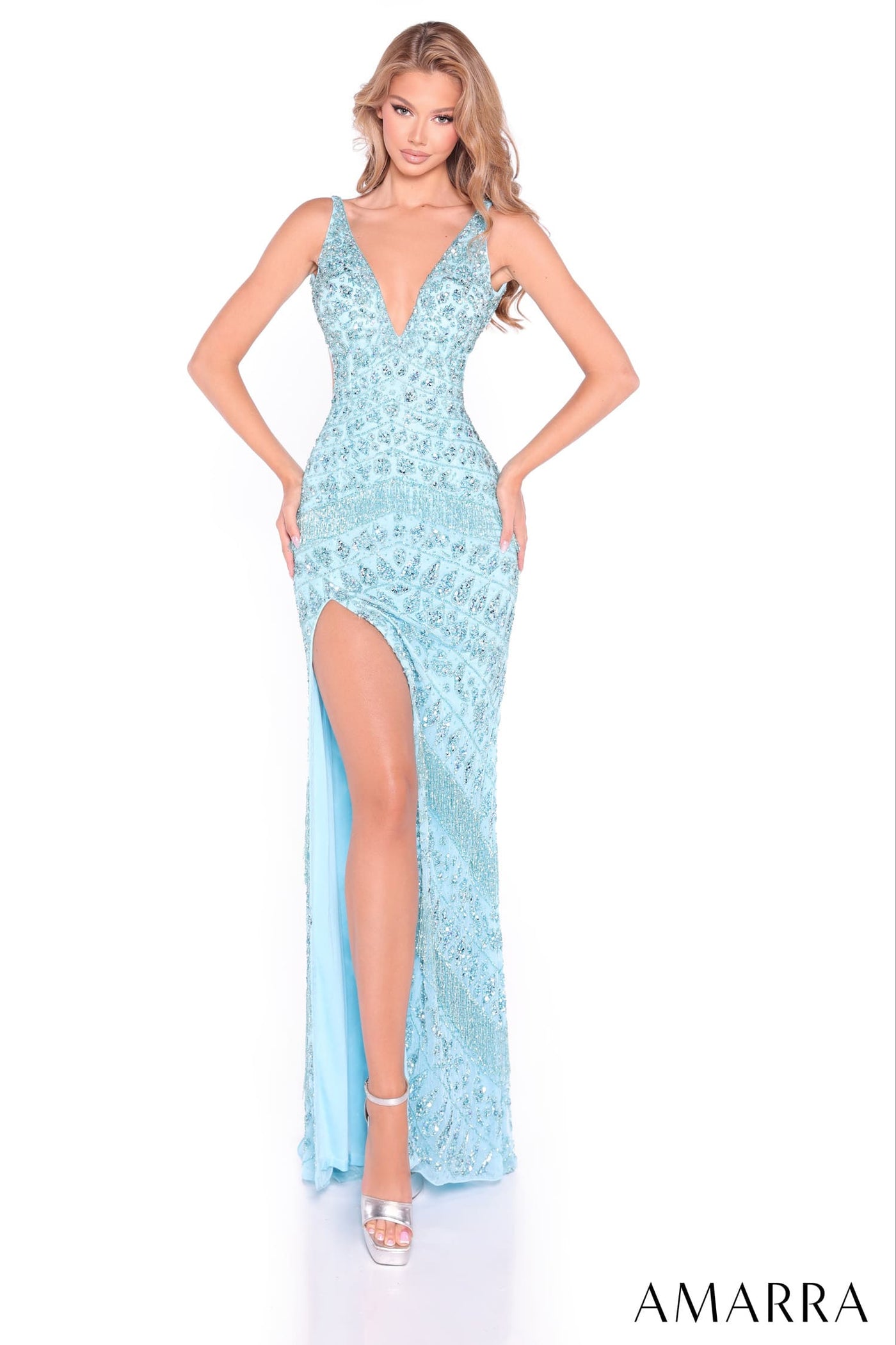 Light blue lace evening gown with a high slit on a white background, featuring the brand 'AMARRA'.