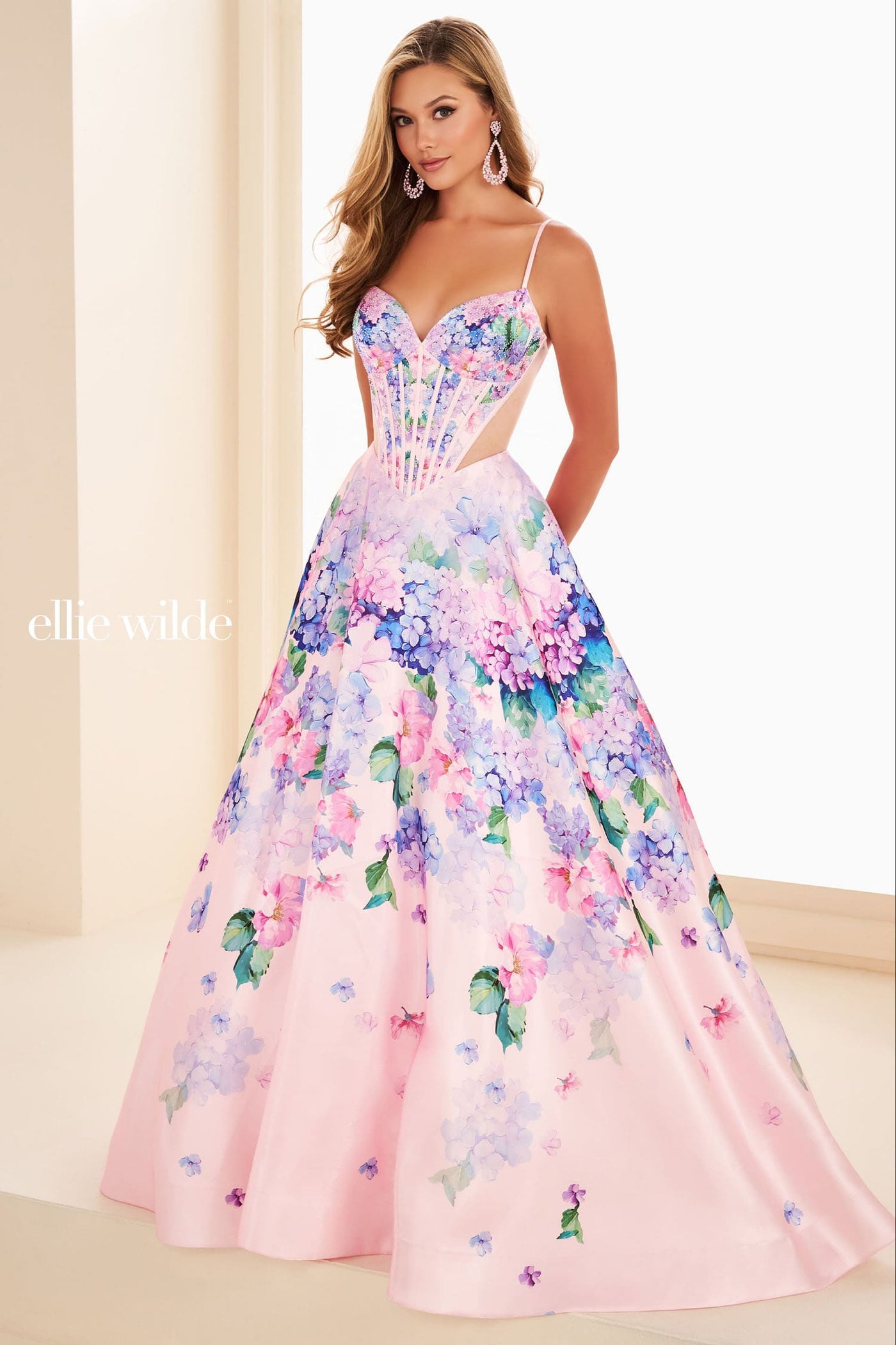 Woman wearing a floral pink dress with a plain background