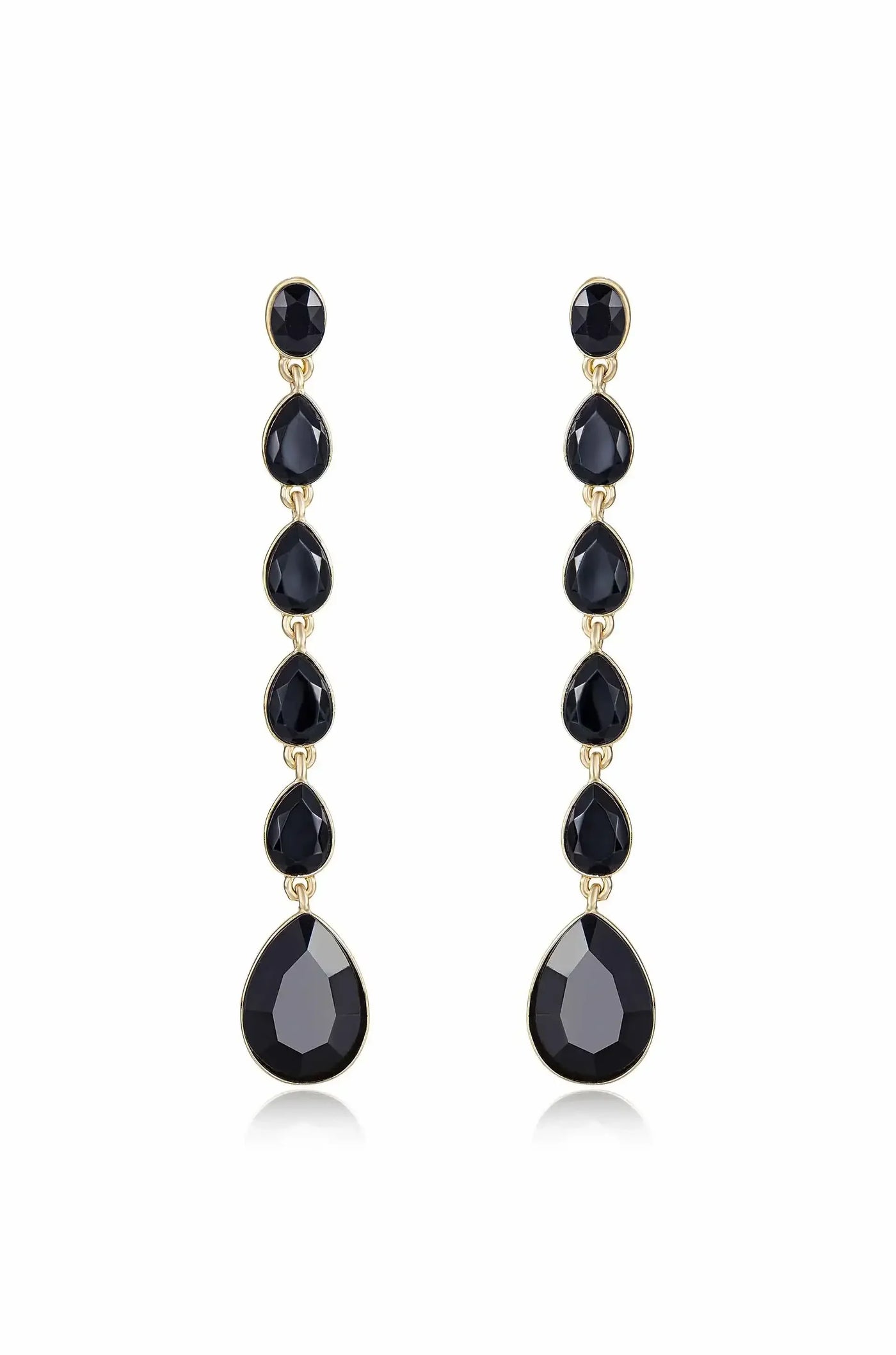 Elegant drop earrings feature a vertical arrangement of black stones, including faceted round and teardrop shapes, all set in a gold-tone metal, creating a sophisticated accessory.