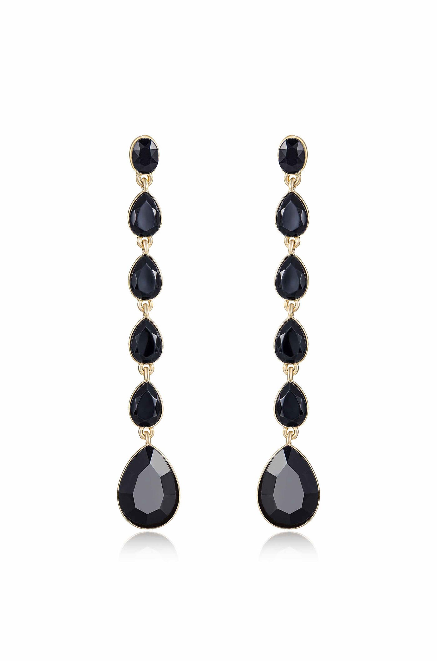 Elegant drop earrings feature a vertical arrangement of black stones, including faceted round and teardrop shapes, all set in a gold-tone metal, creating a sophisticated accessory.