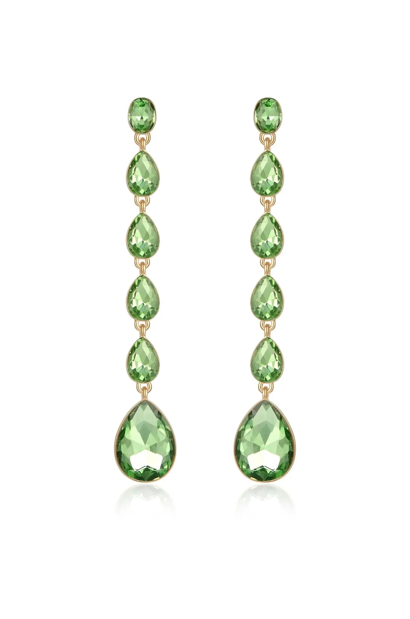 Elegant earrings feature a vertical arrangement of green gemstones in various teardrop shapes, hanging from a gold setting, reflecting light against a neutral background.