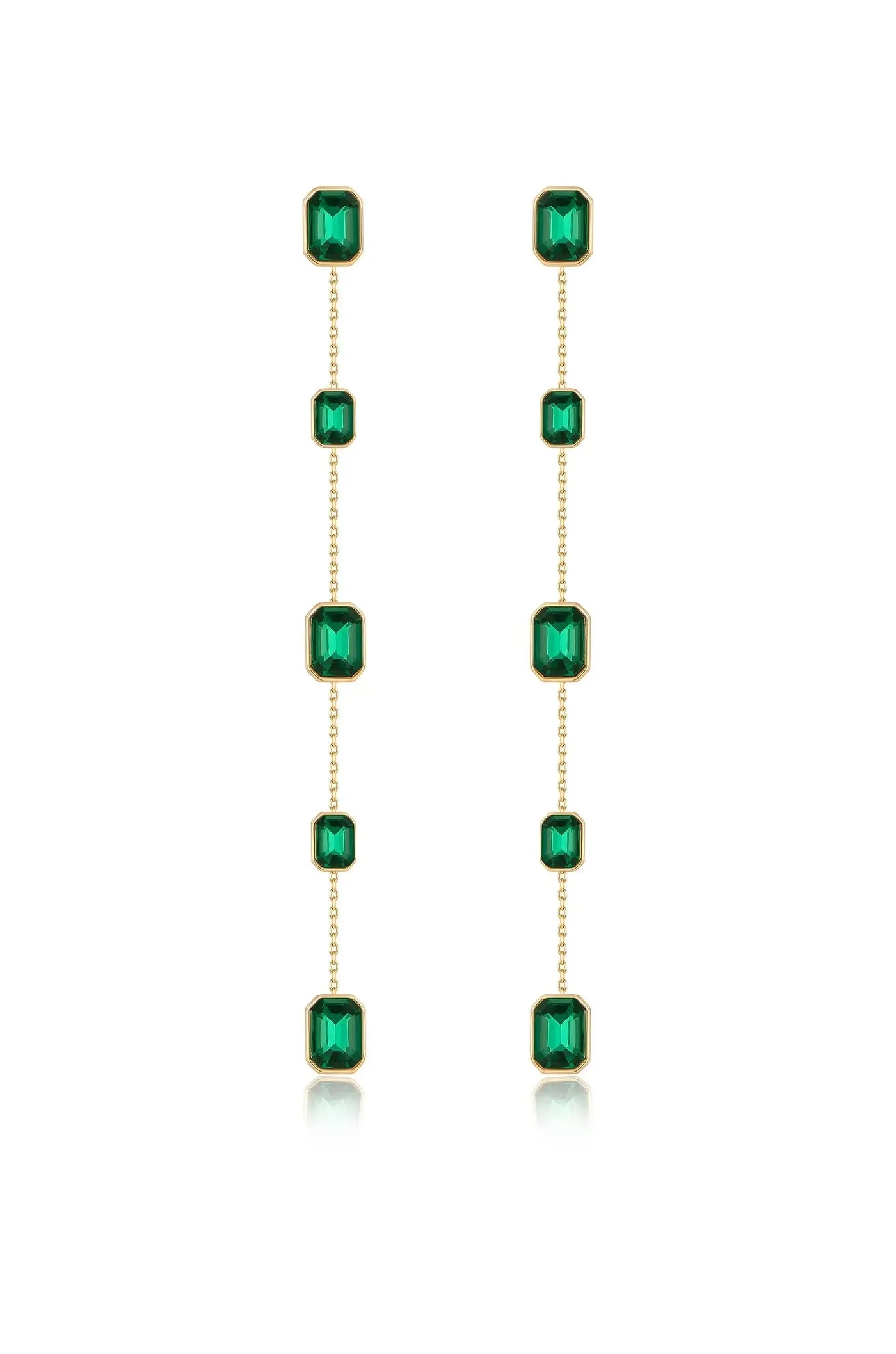 Two dangling earrings are displayed, featuring a series of rectangular green gemstones set in gold. They hang vertically, reflecting light against a white background.