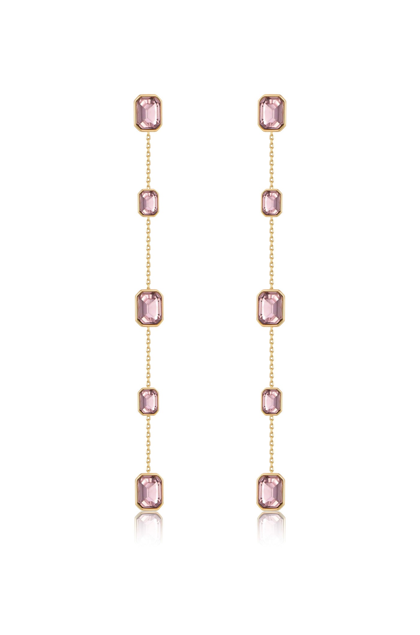 Delicate dangling earrings feature multiple pink gemstones set in gold. The arrangement showcases vertical chains, reflecting light and adding elegance in a neutral backdrop.