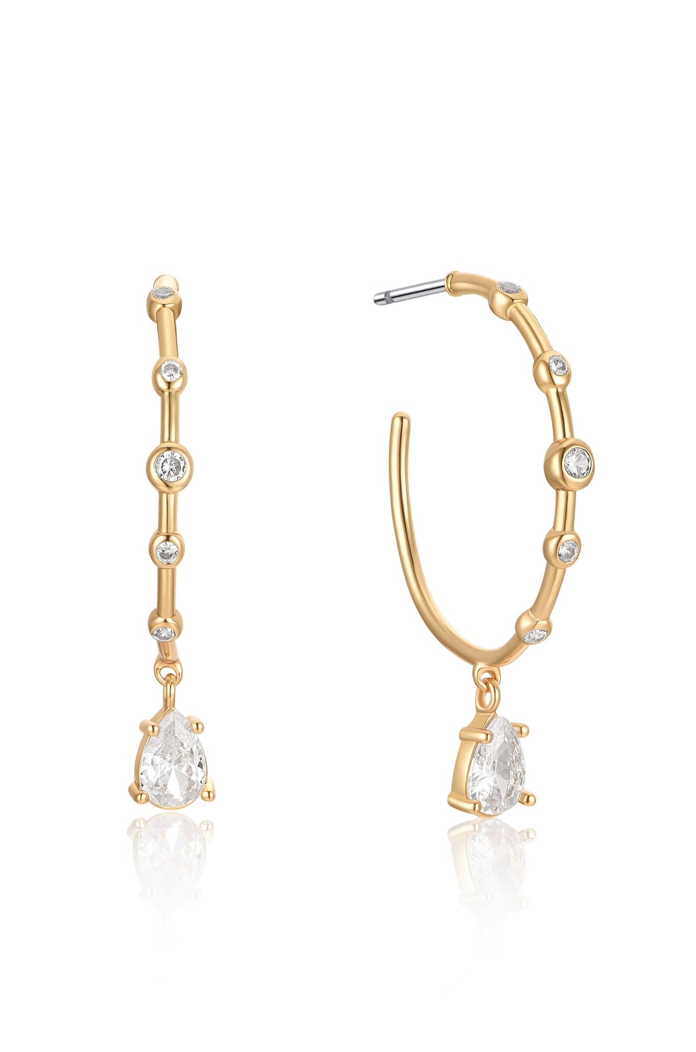 Gold hoop earrings are displayed elegantly, featuring small diamond-like stones along the hoop and a large pear-shaped gem hanging from the bottom, set against a white background.