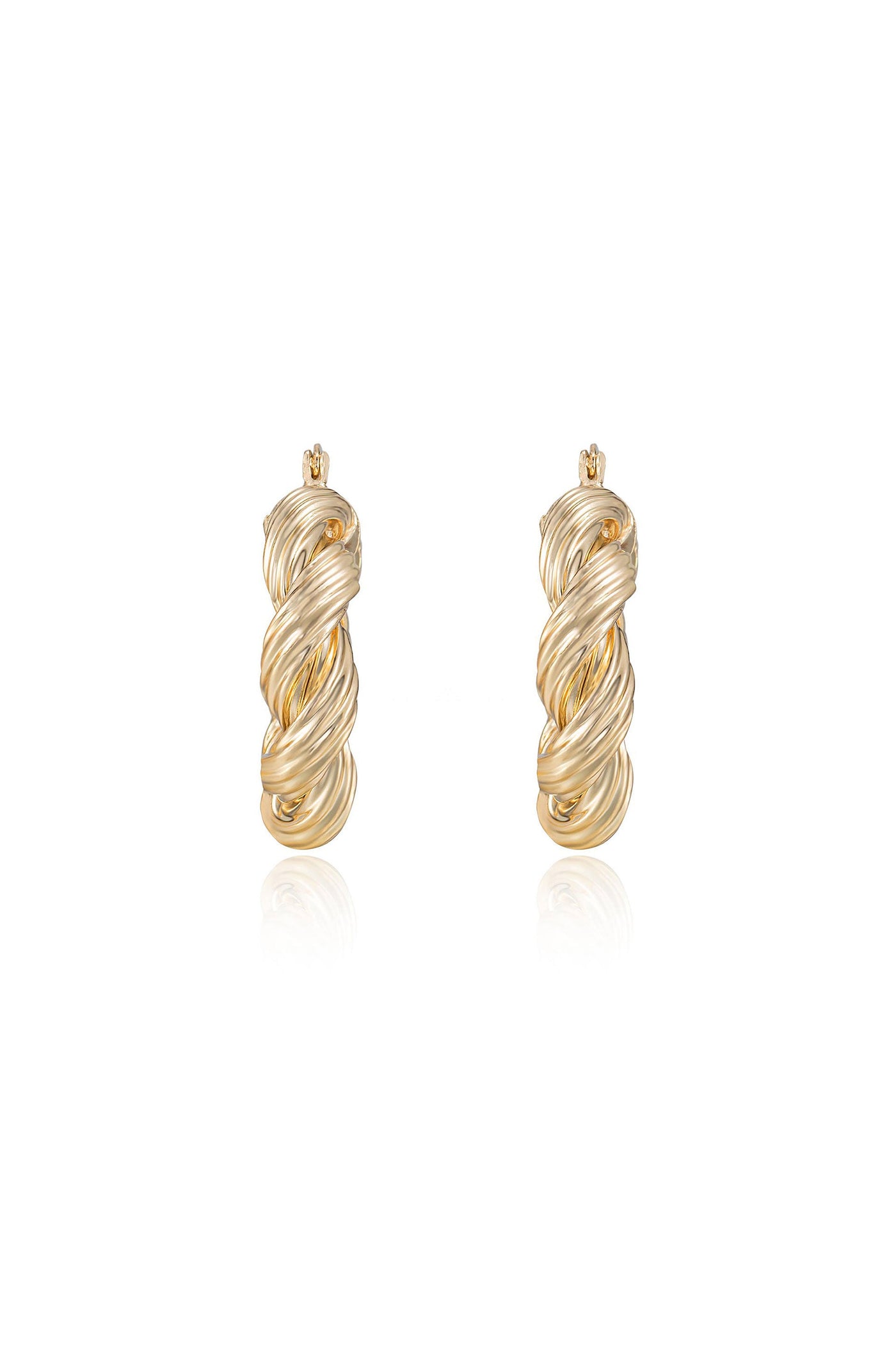 Gold twisted hoop earrings are prominently displayed, reflecting light. They appear to be elegantly crafted with a spiral design, creating a sophisticated look in a clean, minimalist setting.