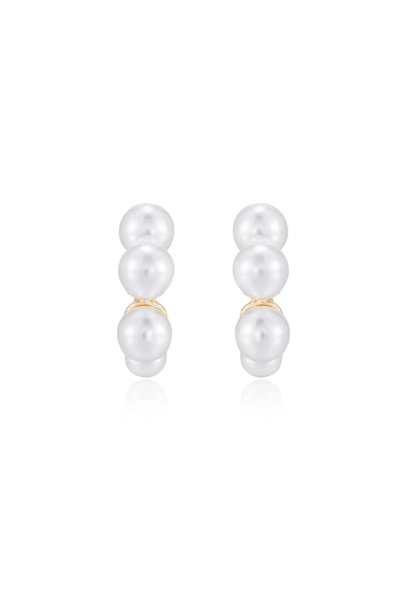Two pairs of pearl earrings are displayed, showcasing three smooth, shiny pearls stacked vertically. The earrings reflect light against a simple, white background, highlighting their elegance.