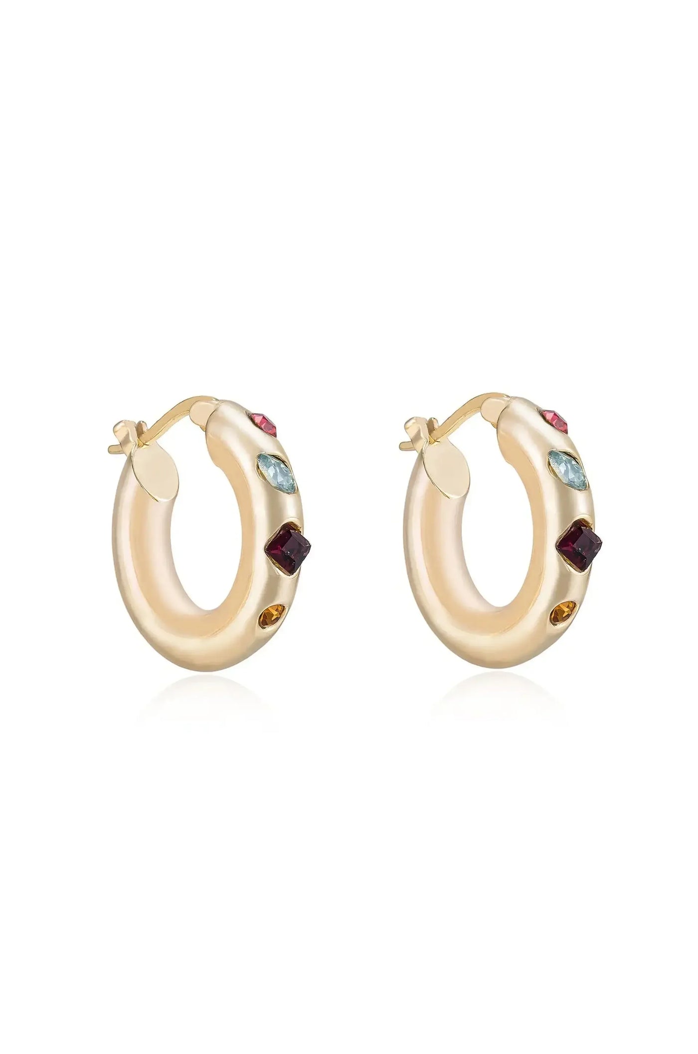 Gold hoop earrings are displayed, featuring colorful gemstones embedded along their surface. The earrings are elegantly shaped and shine against a plain white background, emphasizing their luxury and style.
