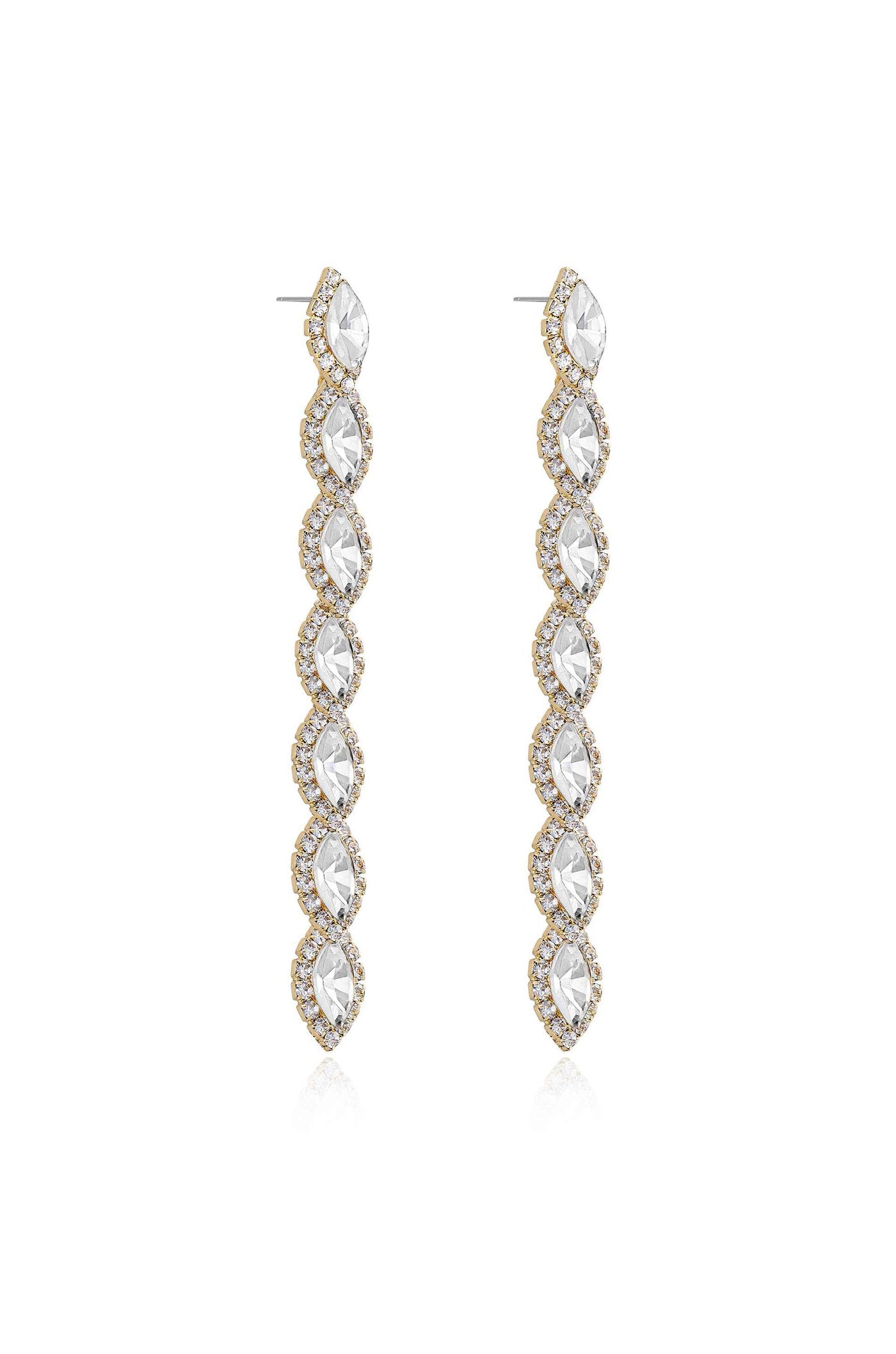 Two long, shimmering earrings hang vertically, featuring a series of marquise-cut stones encircled by small crystals. They are set against a plain, light background.