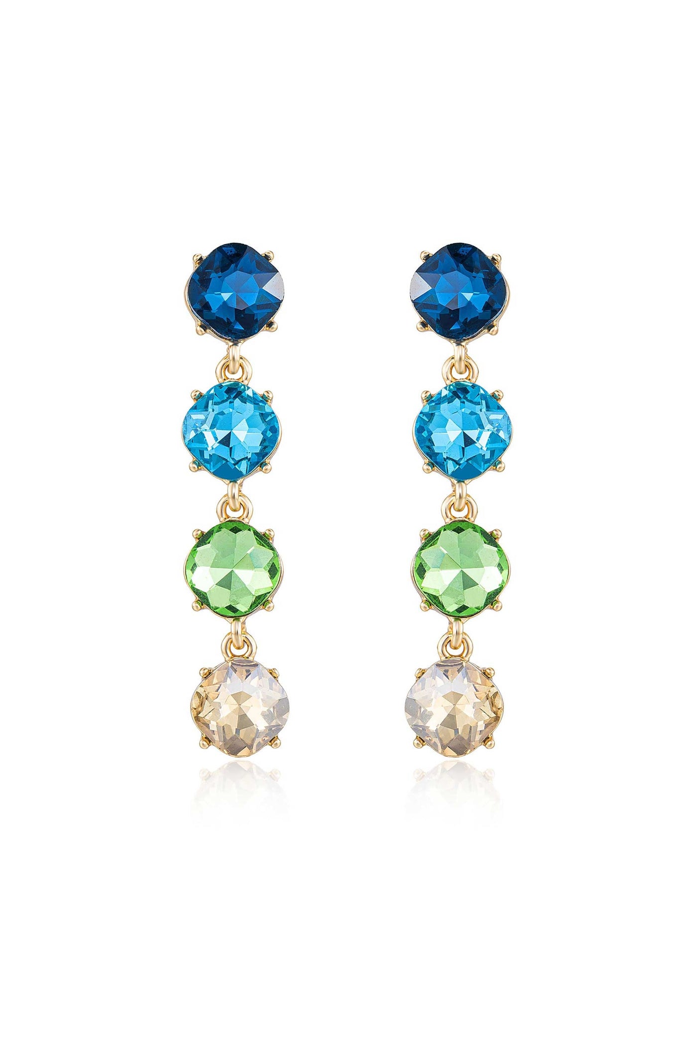 Colorful earrings feature five stacked gemstones in blue, turquoise, green, and clear, all set in gold. They hang elegantly, creating a sparkling effect against a neutral background.