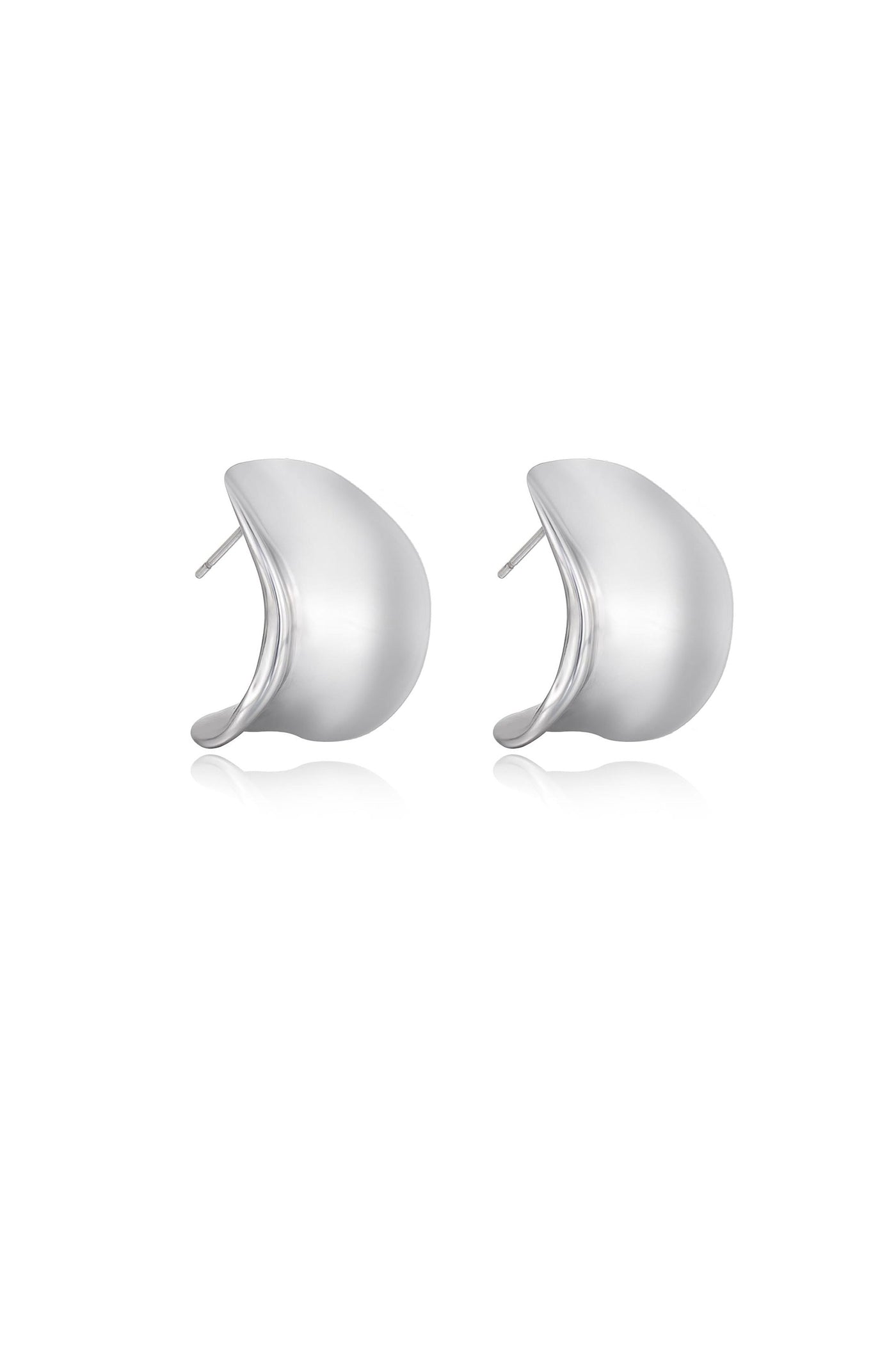 Two silver earrings are displayed together, showcasing a smooth, curved design. They rest on a white background, reflecting light to emphasize their polished surface and elegant shape.