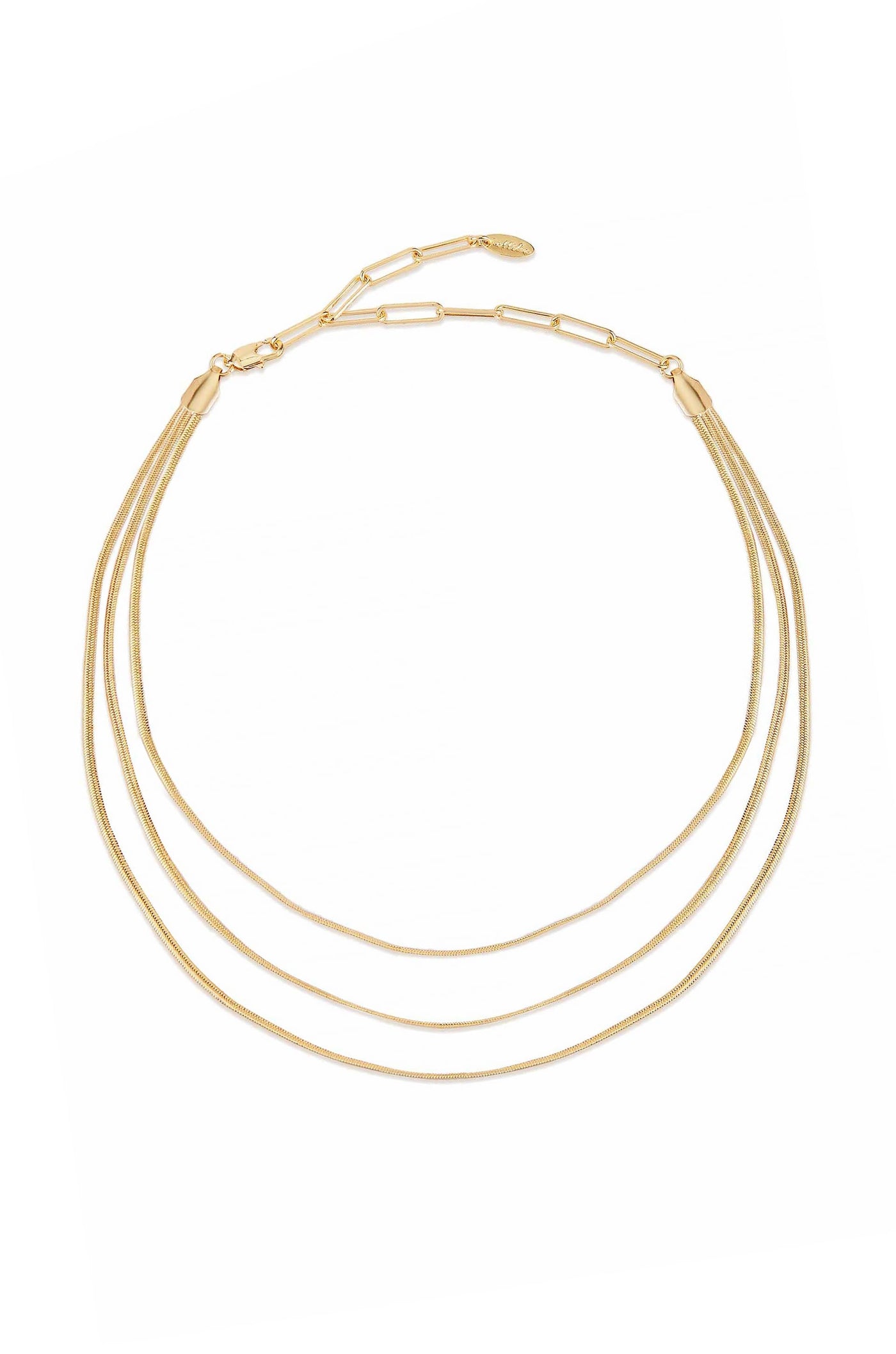 A three-strand gold necklace lies flat, displaying its sleek, shiny texture. It features delicate links and a clasp, set against a plain white background, emphasizing its elegance.