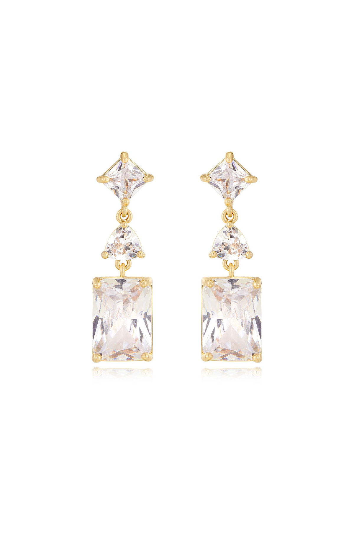 Gold earrings featuring a symmetrical design comprise an upper triangular gemstone, a smaller round gemstone, and a larger rectangular gemstone, reflecting light against a neutral background.
