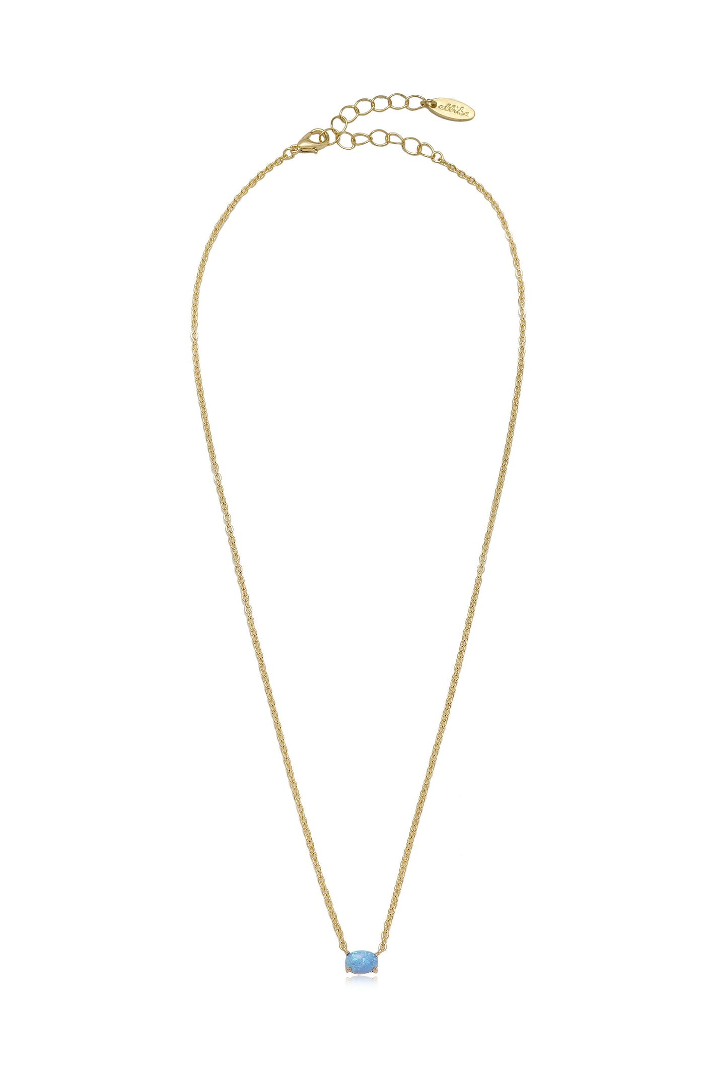 A delicate golden necklace features a thin, twisted chain with a single light blue gemstone at its center, against a simple white background, highlighting its elegance.