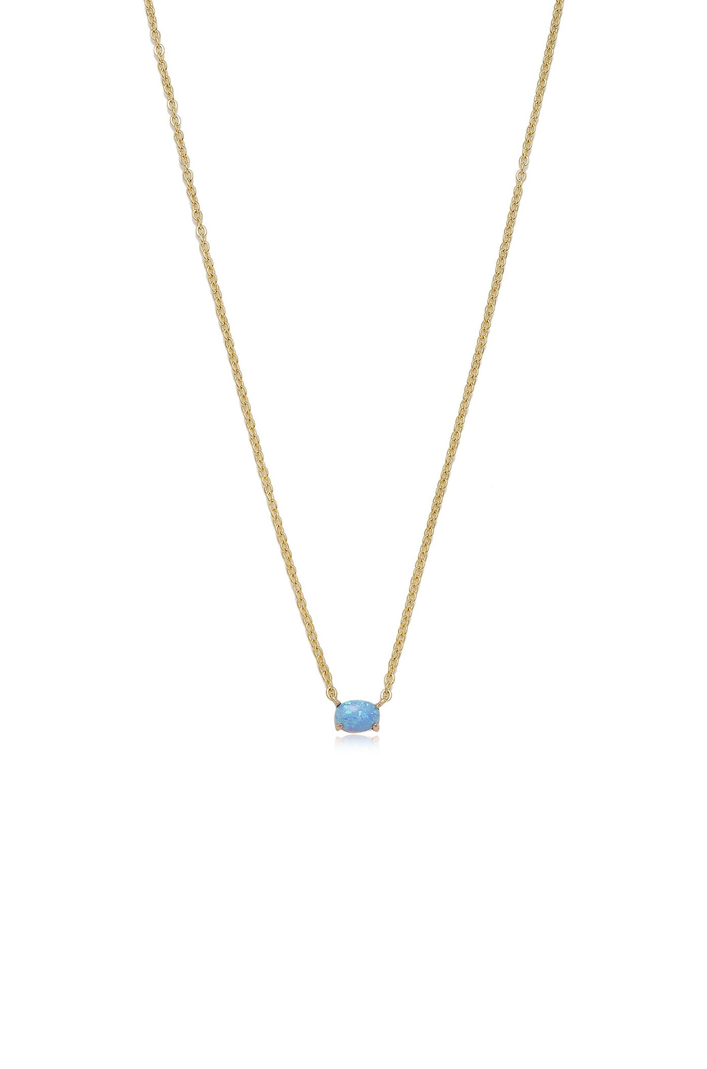 A gold necklace with a simple, delicate chain features a prominent light blue opal pendant centered on it, displayed against a plain white background.