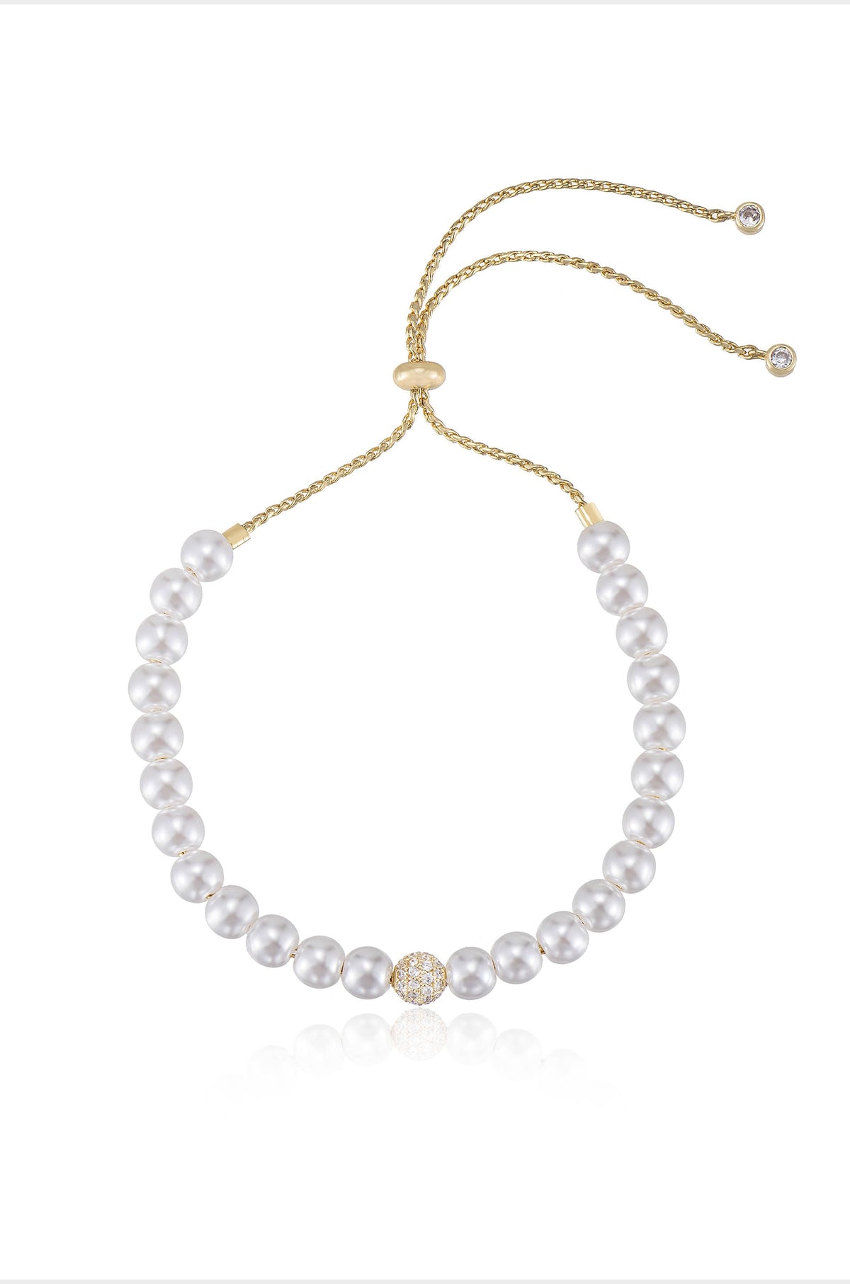 A pearl necklace features evenly spaced white pearls, with a decorative gold and crystal clasp at the center. The background is plain, emphasizing the necklace’s elegance and design.
