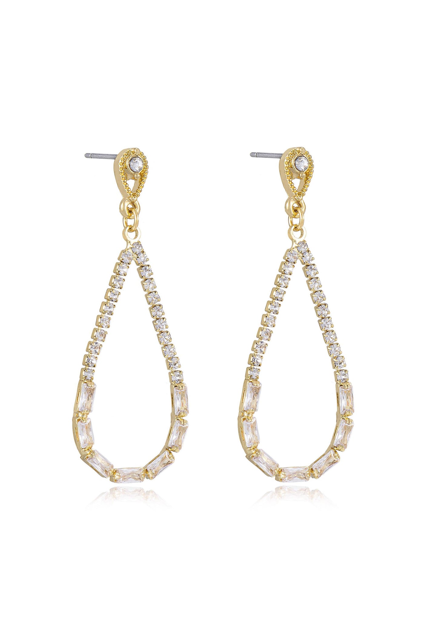 Gold teardrop earrings adorned with sparkling clear crystals hang gracefully. The earrings exhibit a modern design, reflecting light, suitable for formal or elegant occasions.