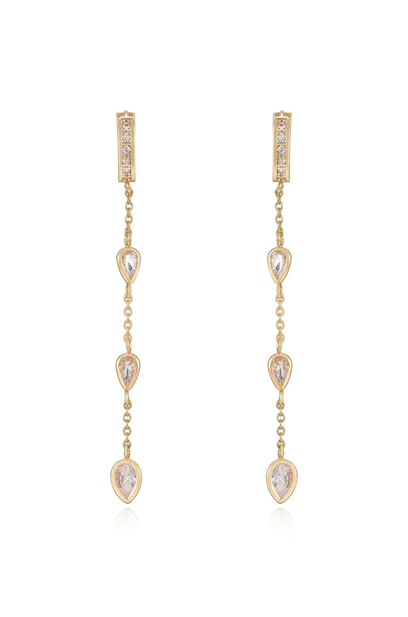 Two elegant gold earrings dangle vertically, featuring a series of three teardrop-shaped stones. Each stone is linked by a delicate chain, exuding a refined and sophisticated style.