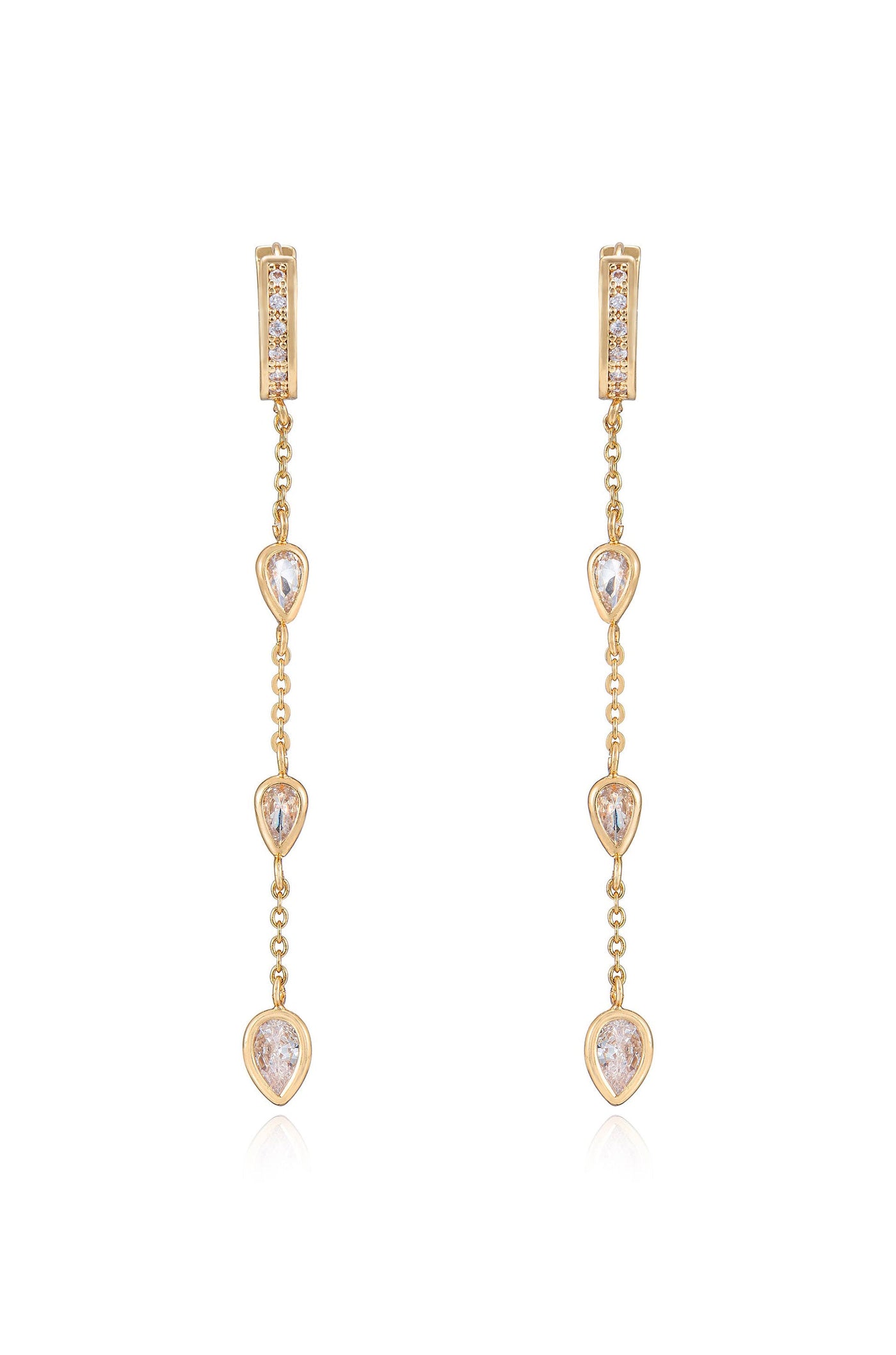 Two elegant gold earrings dangle vertically, featuring a series of three teardrop-shaped stones. Each stone is linked by a delicate chain, exuding a refined and sophisticated style.