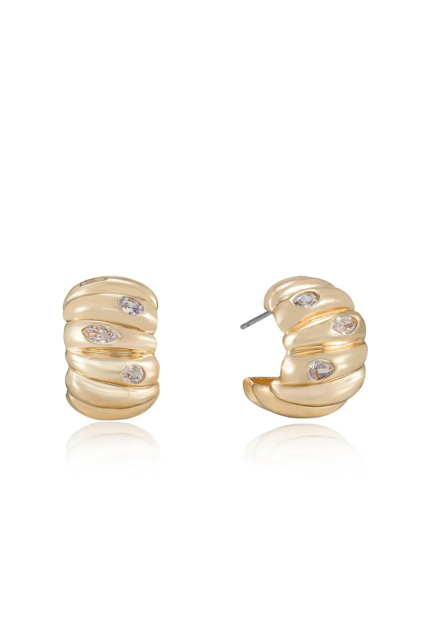 Golden hoop earrings with a textured, swirling design feature embedded clear gemstones. They are displayed on a reflective surface against a plain white background, emphasizing their elegance and shine.