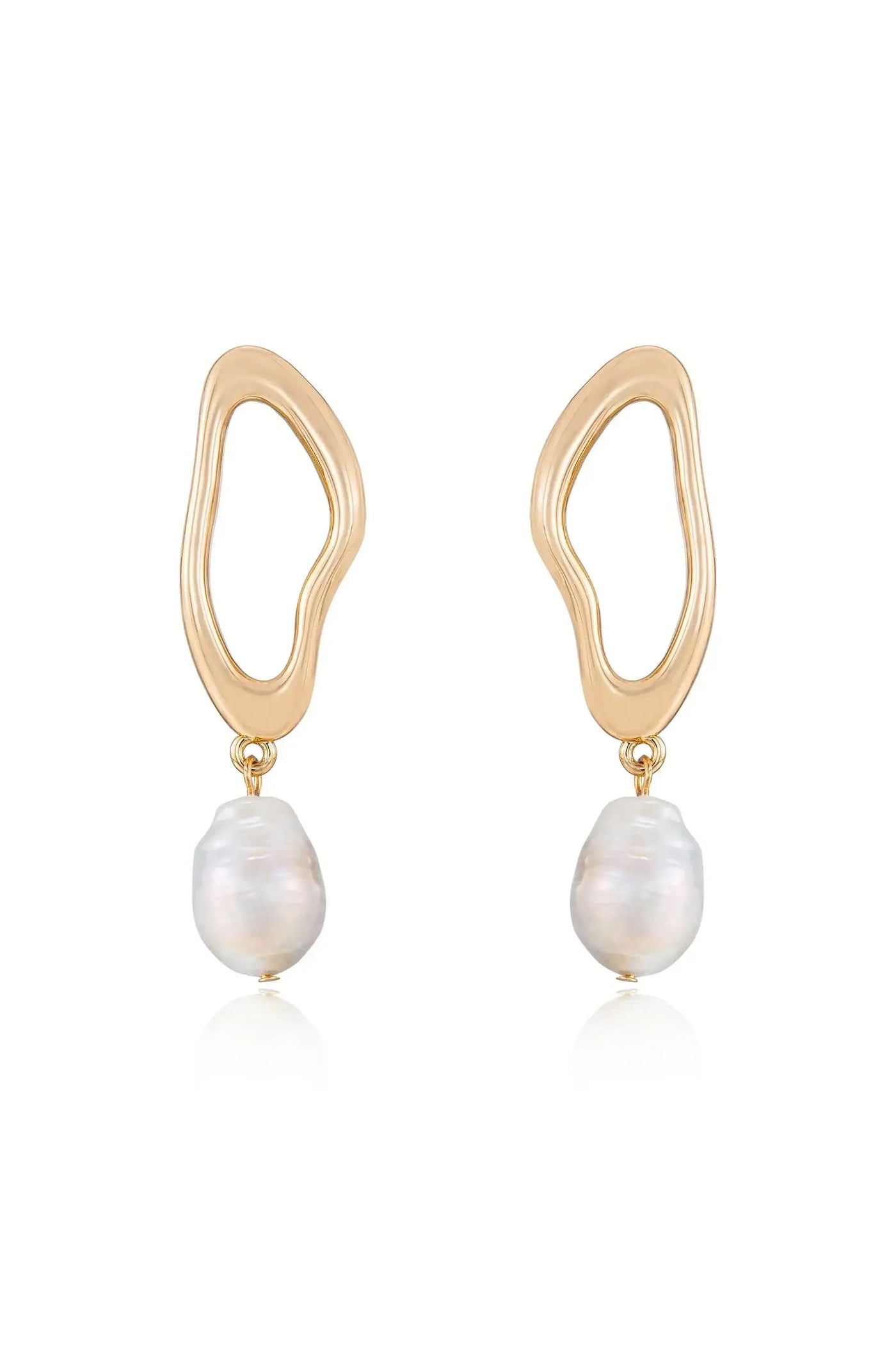Gold earrings are displayed, featuring an abstract, wavy design with a drop section holding a smooth, white pearl. The background is neutral, enhancing the jewelry's elegance.