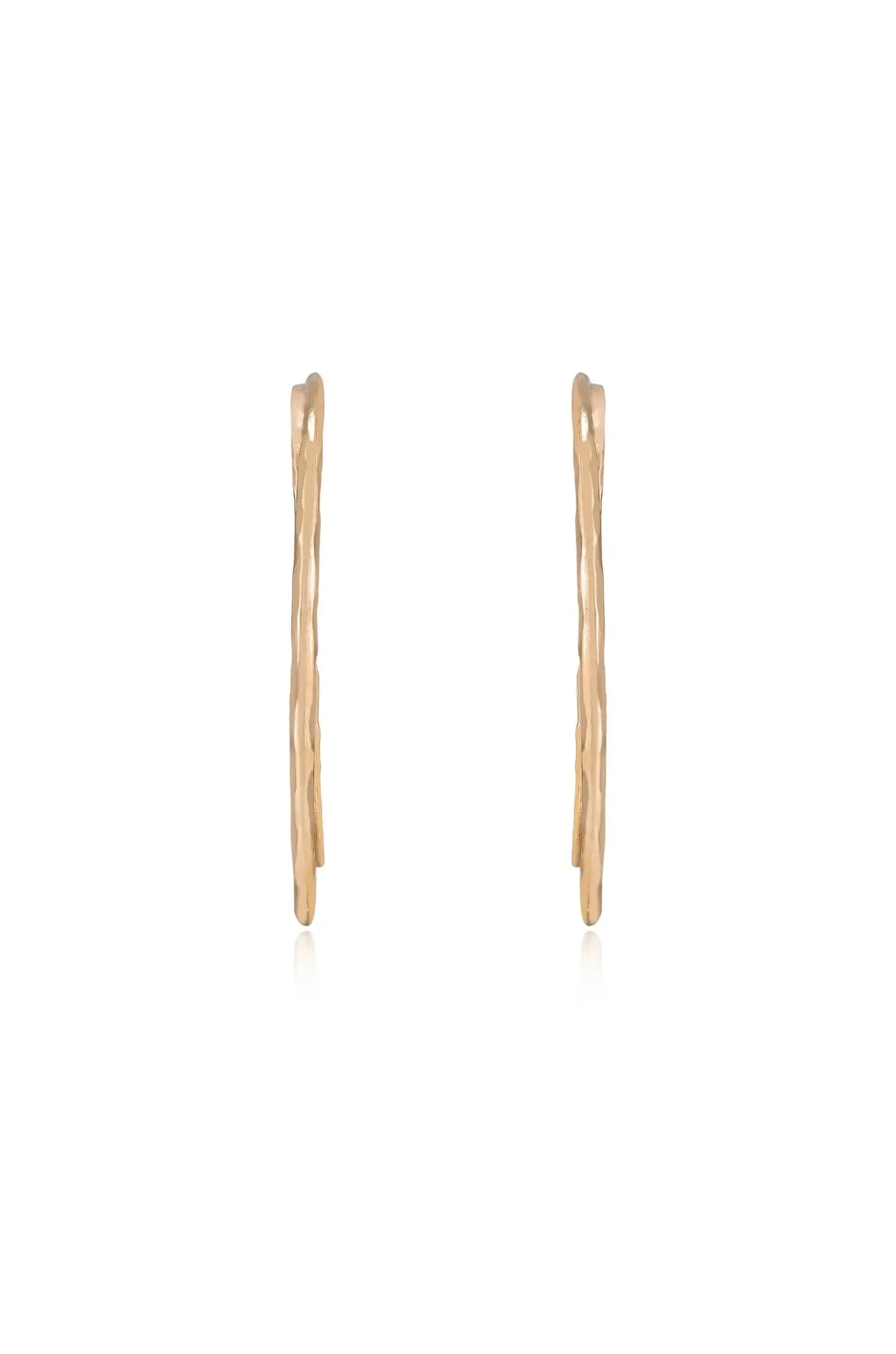 Two elongated, textured gold earrings are displayed upright against a plain white background, showcasing their unique design and shiny surface, ready for potential wear or sale.