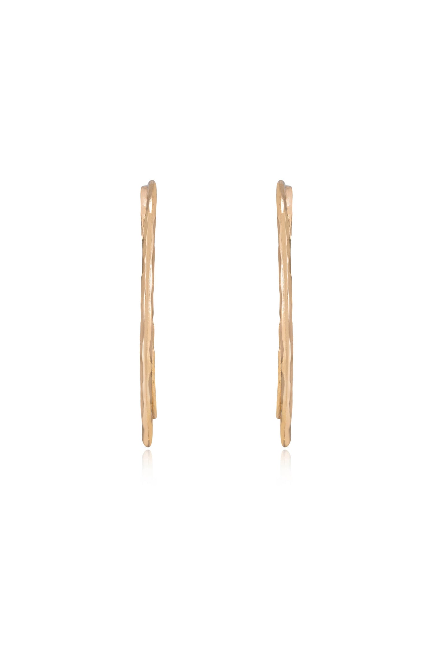 Two elongated, textured gold earrings are displayed upright against a plain white background, showcasing their unique design and shiny surface, ready for potential wear or sale.