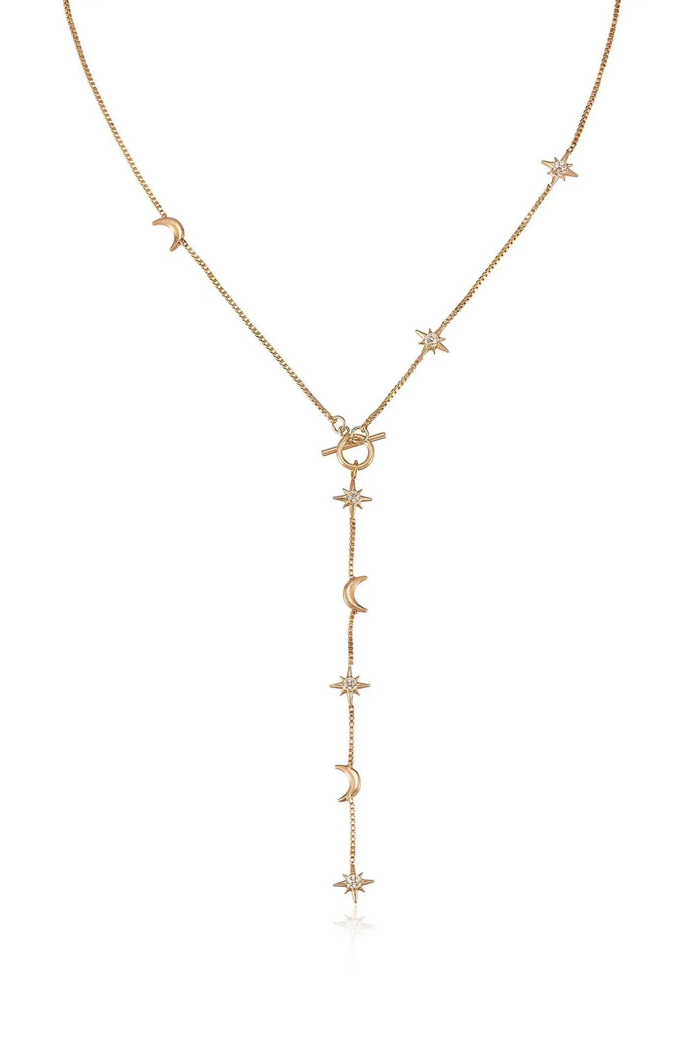A gold necklace features a chain adorned with alternating crescent moons and star motifs. The design culminates in a lariat style with a central clasp, emphasizing elegance and celestial themes.