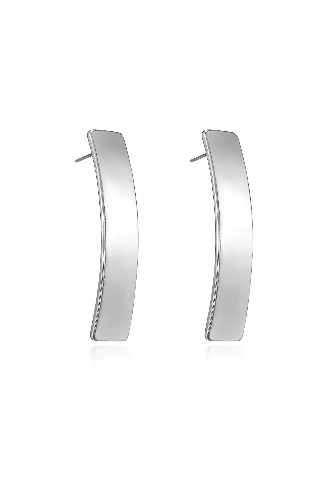 Two polished silver earrings, shaped like curved rectangles, are displayed upright. They reflect light, enhancing their sleek design against a neutral backdrop, showcasing their modern elegance.