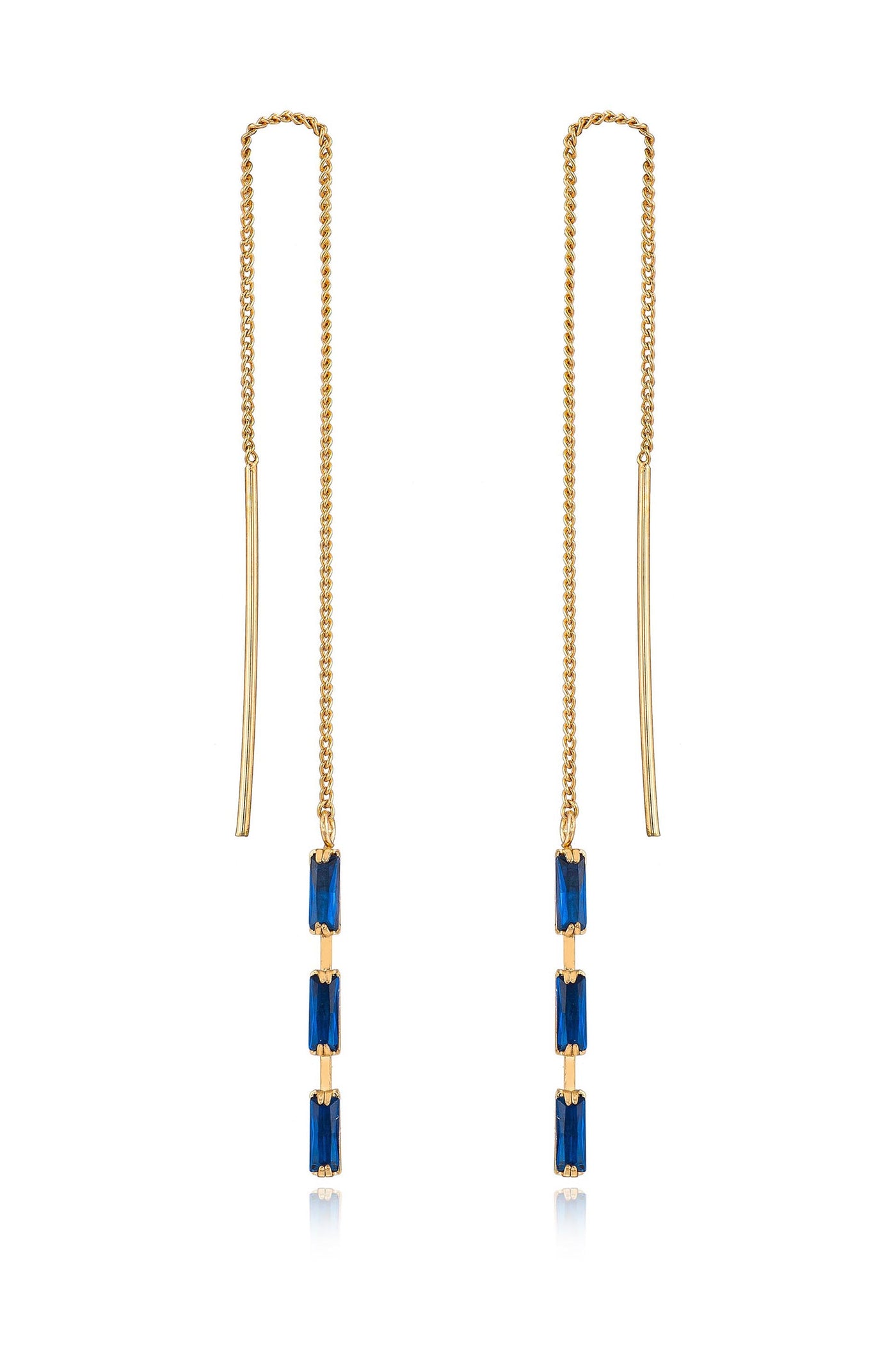 Gold earrings featuring two chains, each adorned with a sequence of three rectangular blue gemstones. The earrings hang elegantly, reflecting light against a plain background.