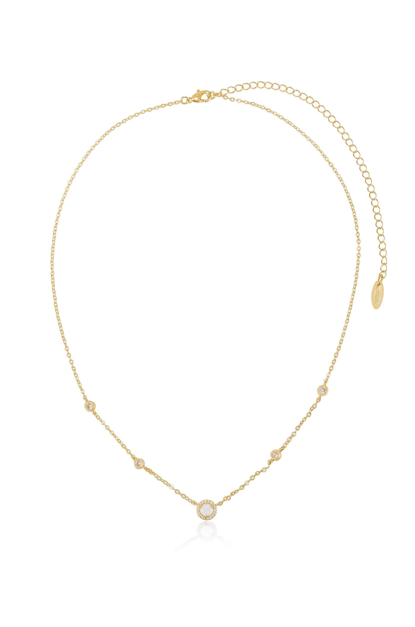 A delicate gold necklace features multiple small circular embellishments, alternating in design and size, showcasing a polished sheen against a simple white background.