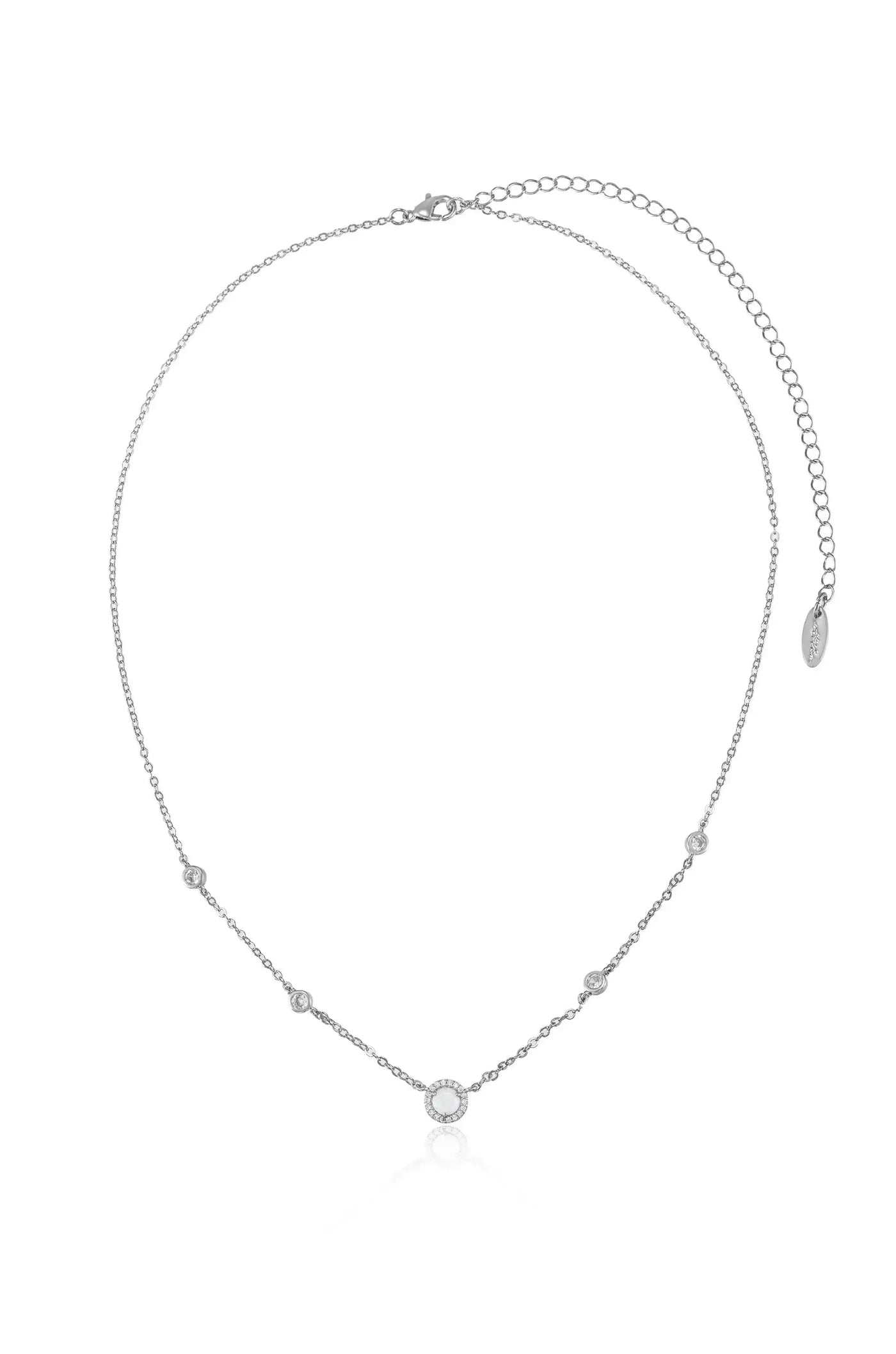 A delicate silver necklace features small circular embellishments, including a prominent central stone. It appears elegant, suitable for formal or casual occasions, set against a neutral background.