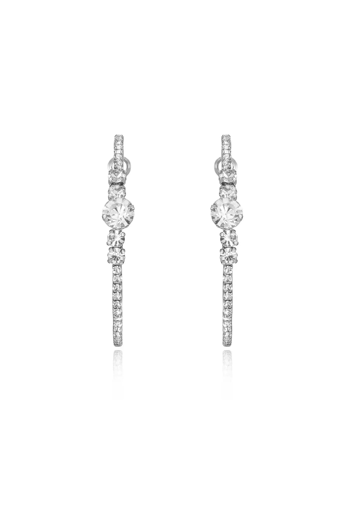 Two elegant earrings featuring sparkling gems, positioned symmetrically. They appear to dangle freely, reflecting light, on a plain white background, emphasizing their shine and design.