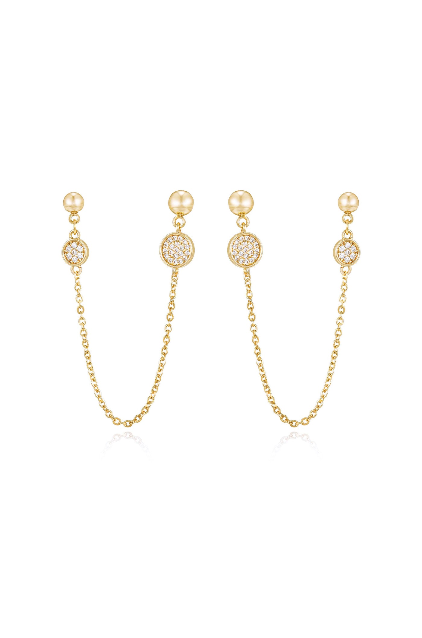 Gold earrings featuring two pendants connected by delicate chains. Each pendant has a central round design embellished with sparkling stones, reflecting light against a plain white background.