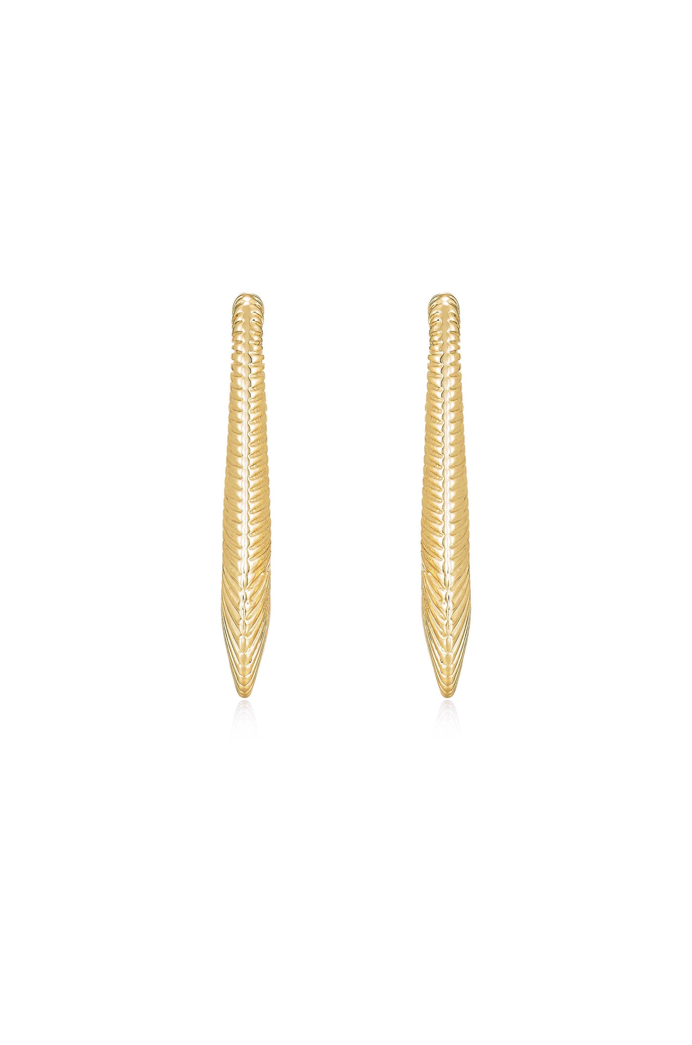 Two sleek, elongated gold earrings are displayed upright. Their textured surfaces reflect light, showcasing a shimmering design. The background is plain white, emphasizing the earrings' polished appearance.