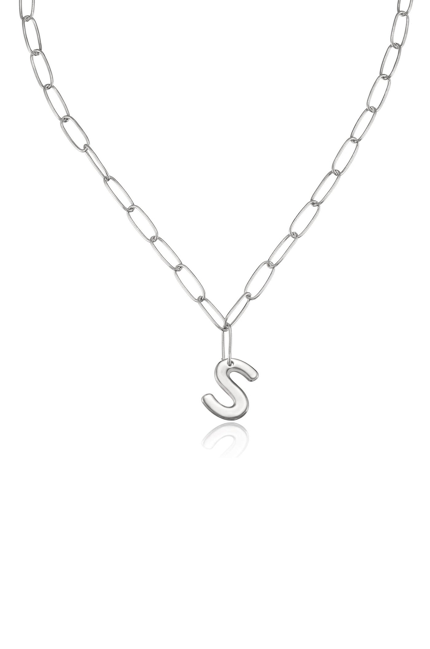 A silver chain necklace features elongated links, holding a stylized "S" pendant at the center. The necklace is displayed against a white background, emphasizing its shine and design.