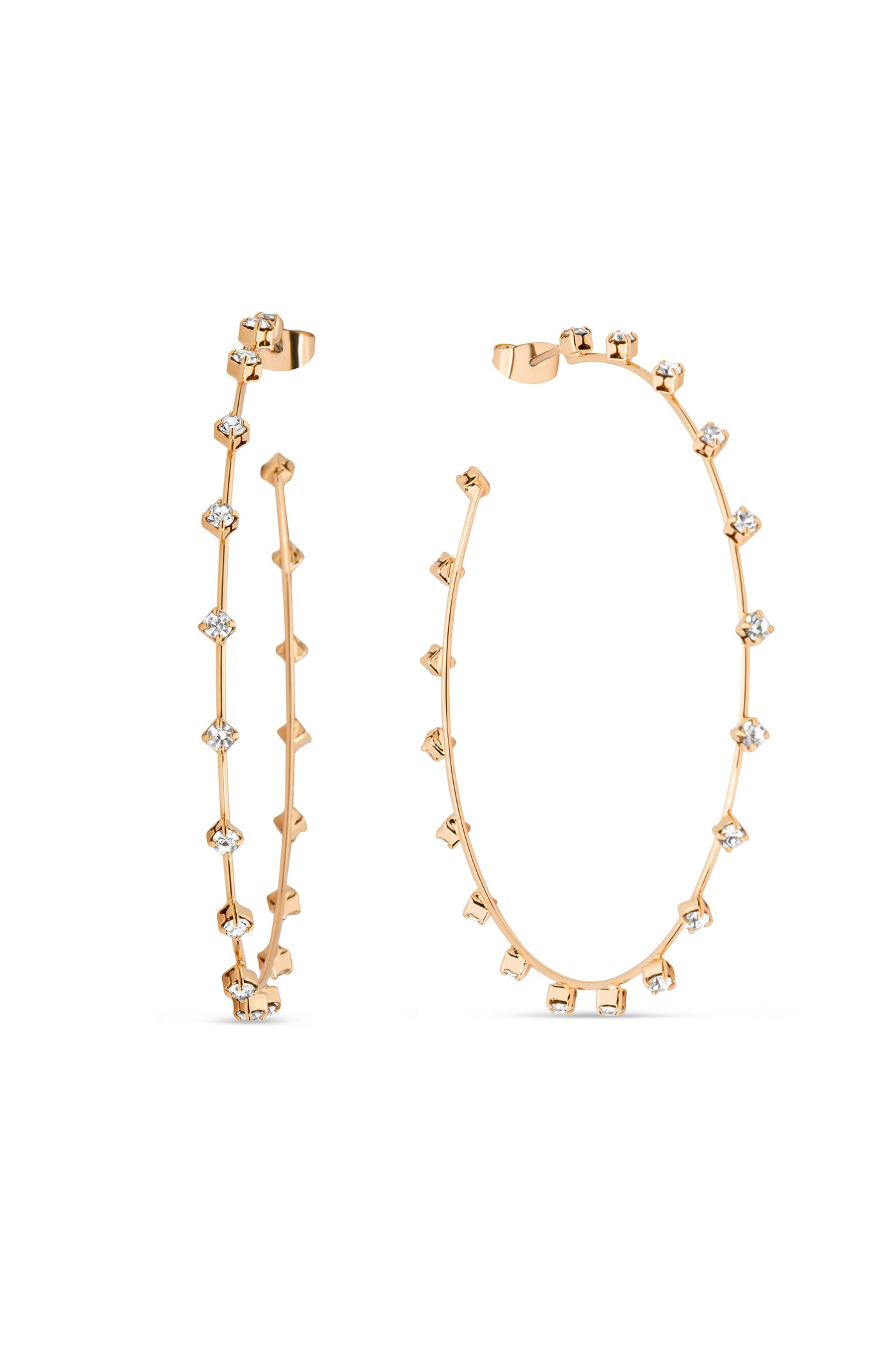 A pair of gold hoop earrings features small, alternating studs and transparent gemstones embedded along their length. They are elegantly displayed against a plain white background, showcasing their design.