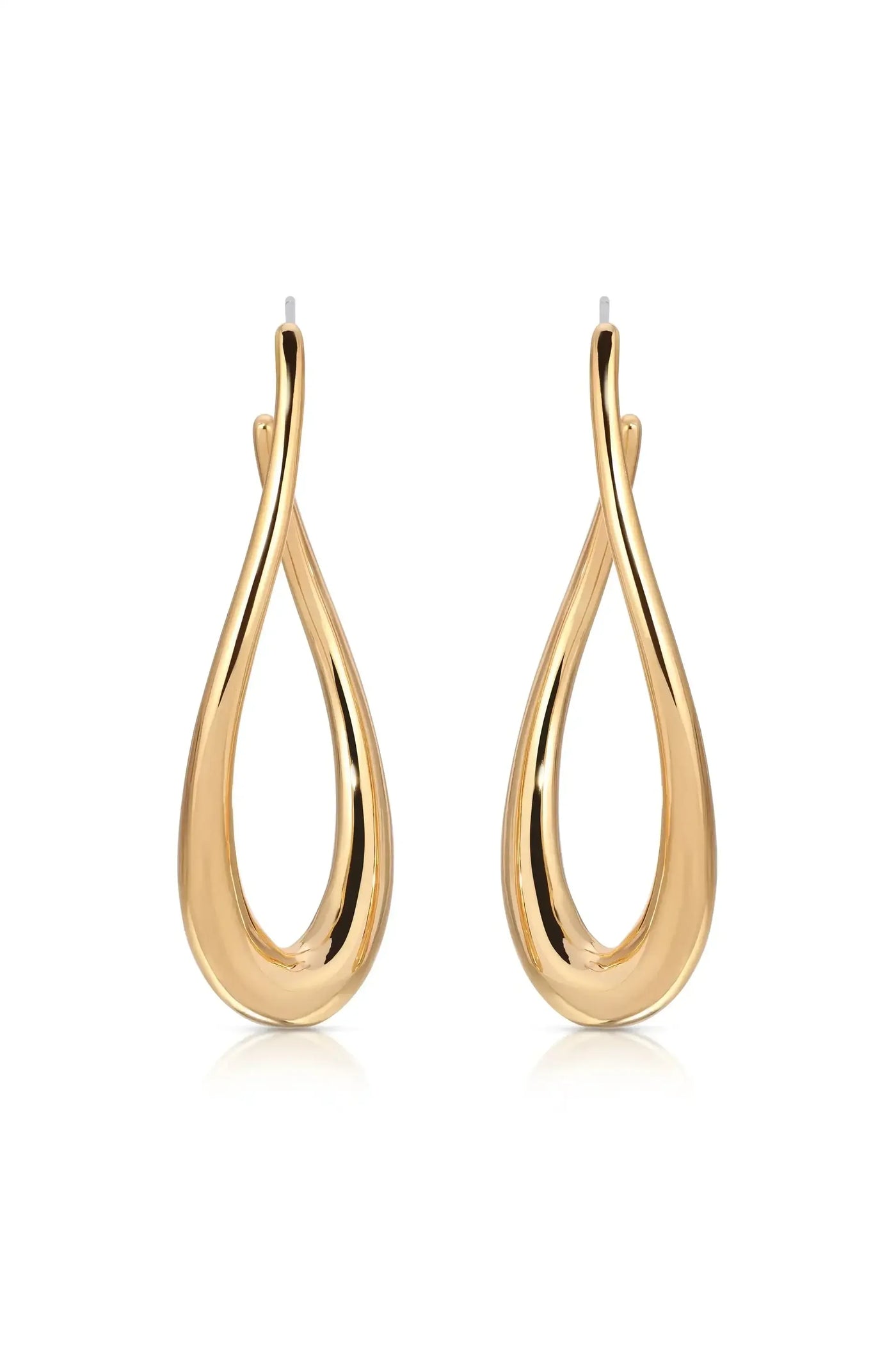Gold hoop earrings are displayed side by side, showcasing a smooth, teardrop shape with a twisting design. They rest against a reflective surface, enhancing their shiny finish.