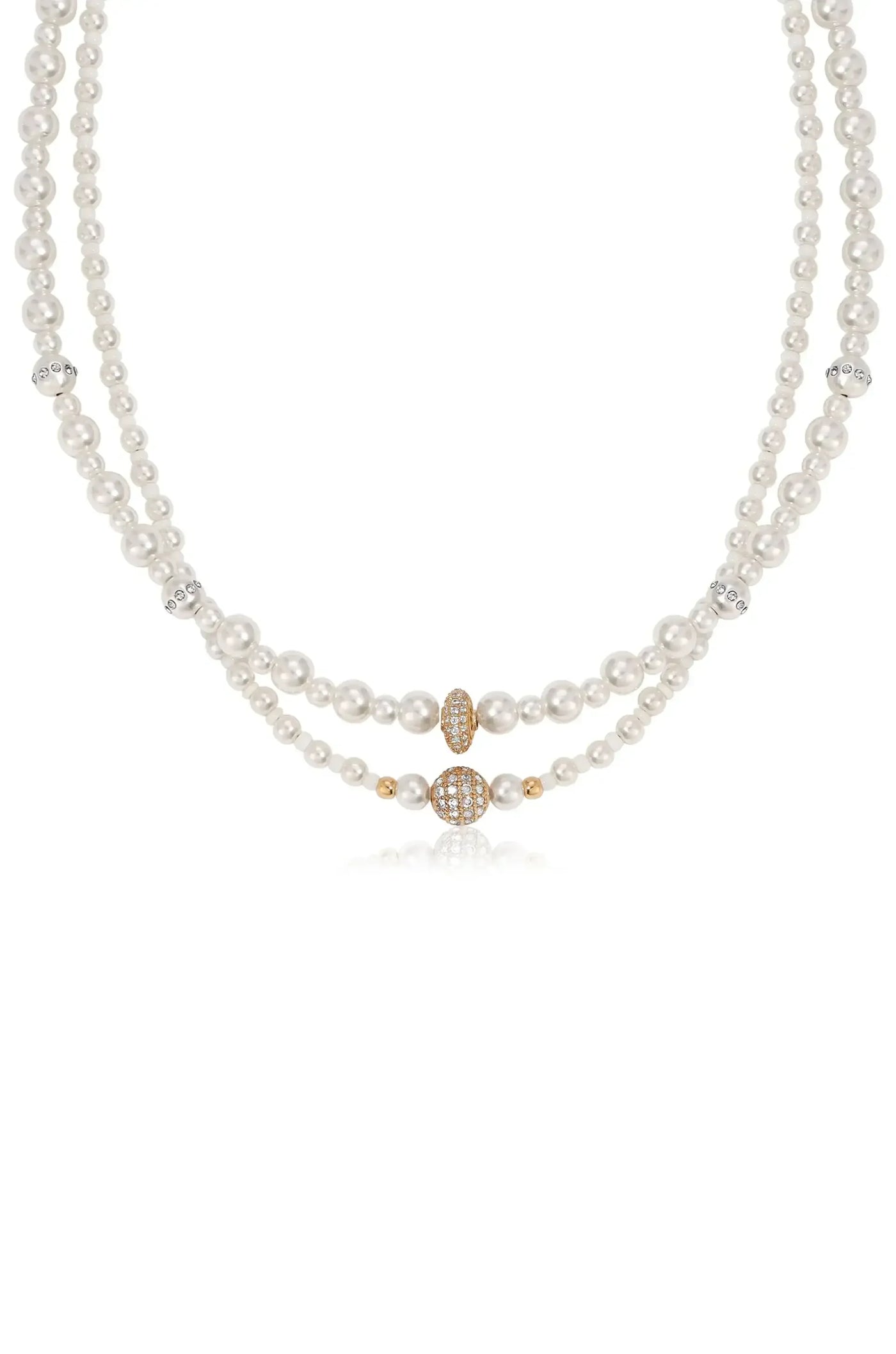 A pearl necklace features two strands of lustrous white pearls, interspersed with gold and diamond-encrusted accents, set against a clean, neutral background, highlighting its elegance and design.