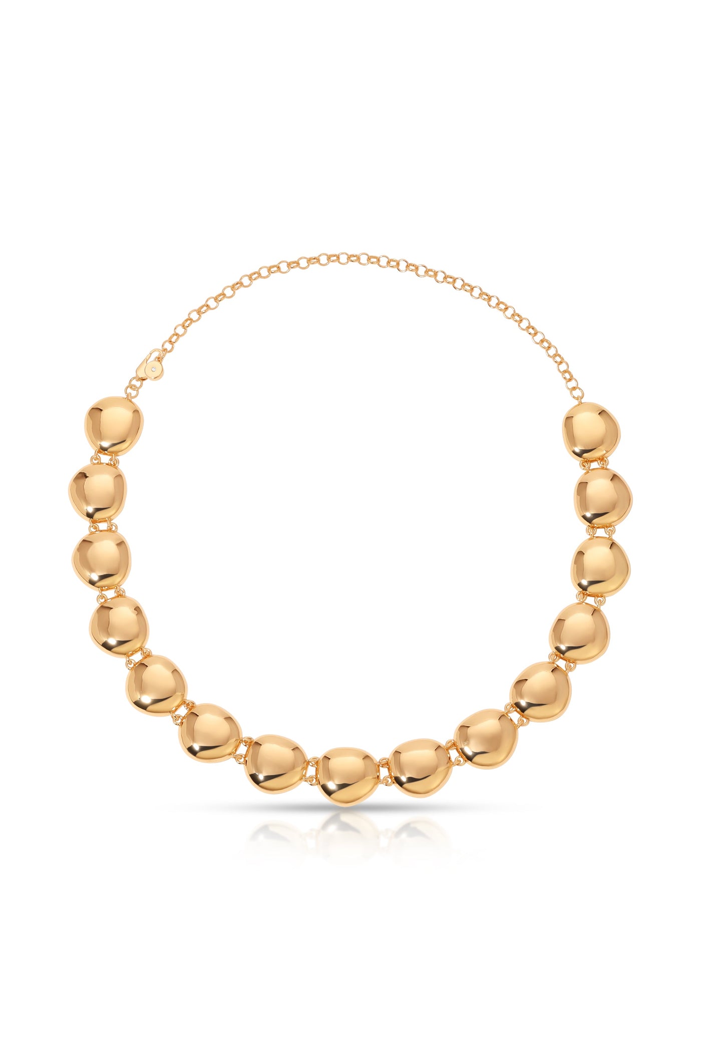 A polished golden necklace features a series of smooth, rounded beads joined by links. It rests on a reflective surface, highlighting its shiny texture and elegant design.