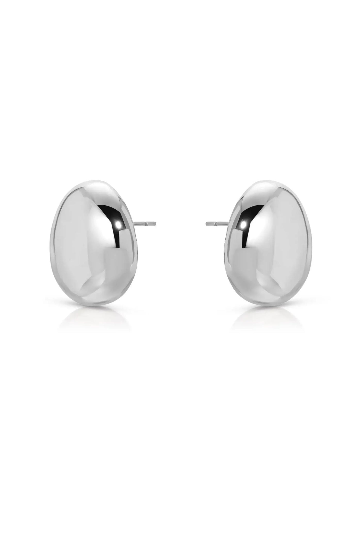 Shiny silver stud earrings are displayed symmetrically, reflecting light. They are designed with a smooth, rounded surface and are set against a plain white background.