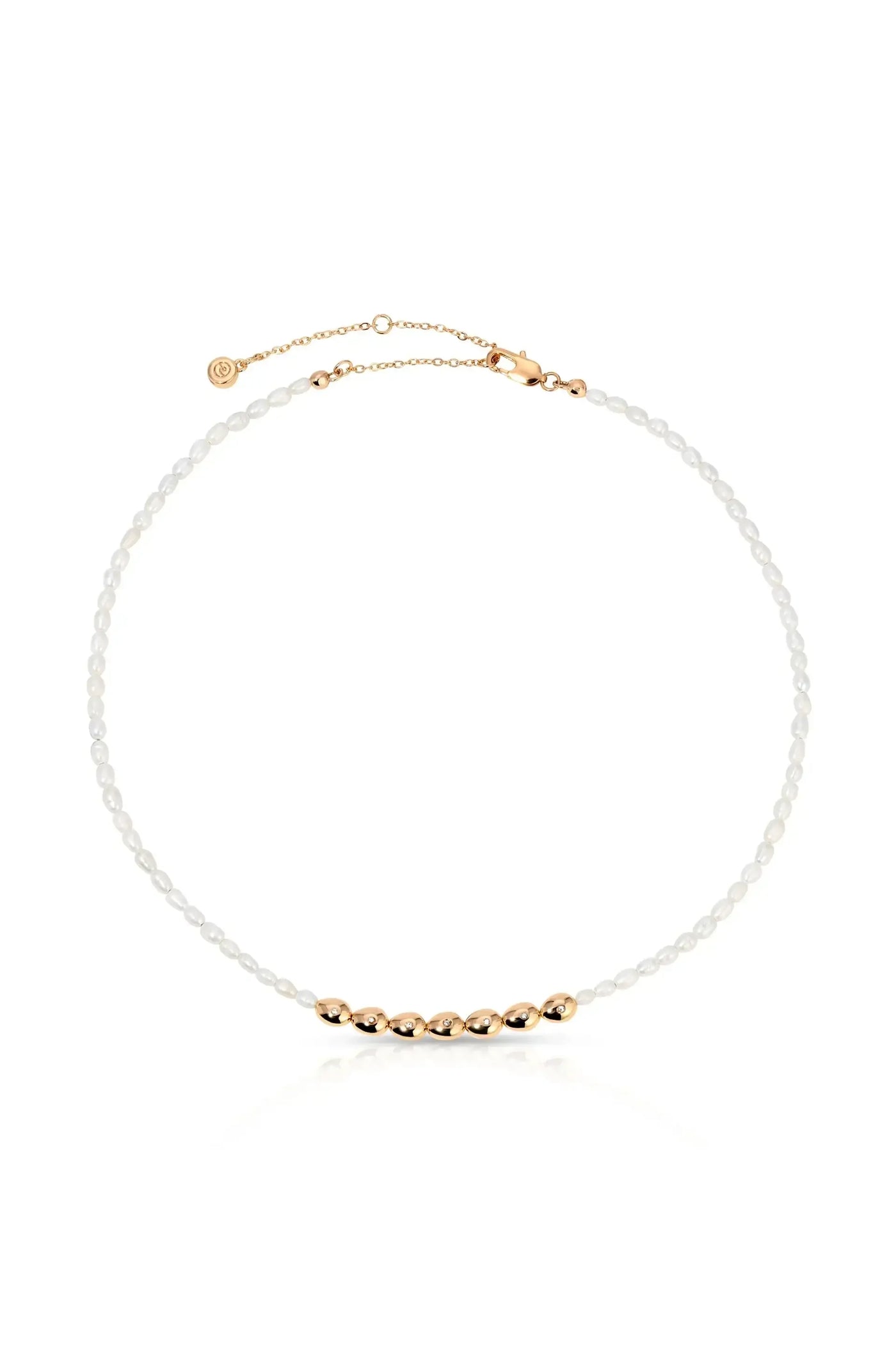 A delicate necklace features small pearls interspersed with shiny gold beads. It is designed to be worn around the neck, showcasing an elegant blend of materials.