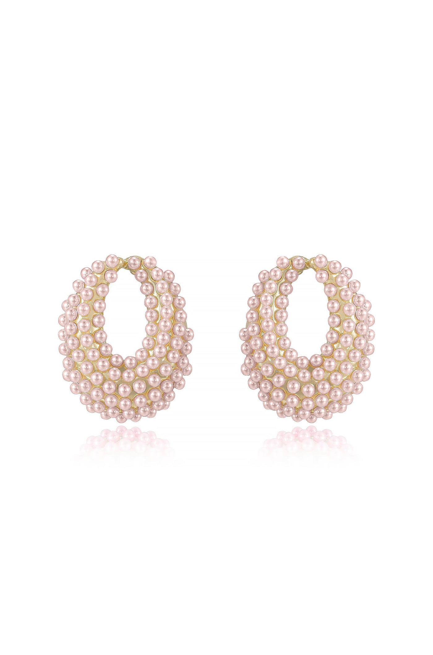 A pair of elegant earrings, shaped like hoops, features layered strands of small pink pearls. They are displayed on a reflective white surface, emphasizing their shiny quality and intricate detail.
