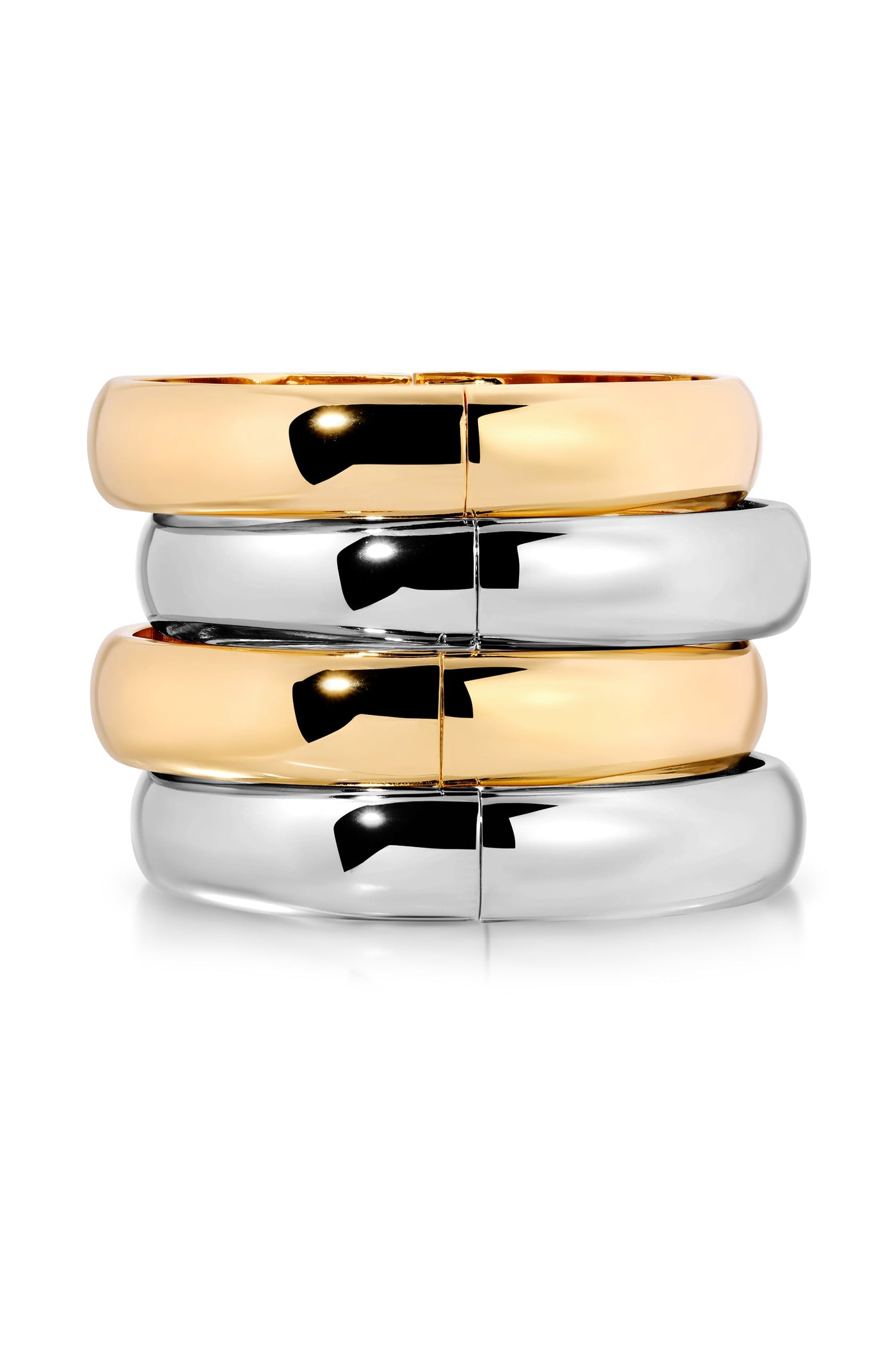 Three stacked bangle bracelets are displayed: one shiny gold on top, followed by two silver ones, with a smooth, reflective surface, against a plain white background.