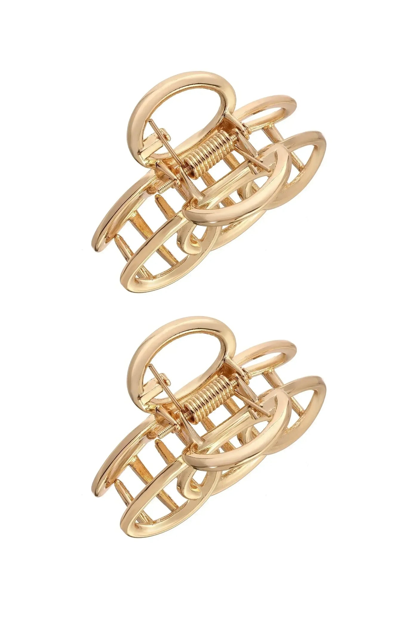 Two gold hair clips are arranged in a stacked position. The clips feature a unique, open oval design with a spring mechanism, set against a plain white background.