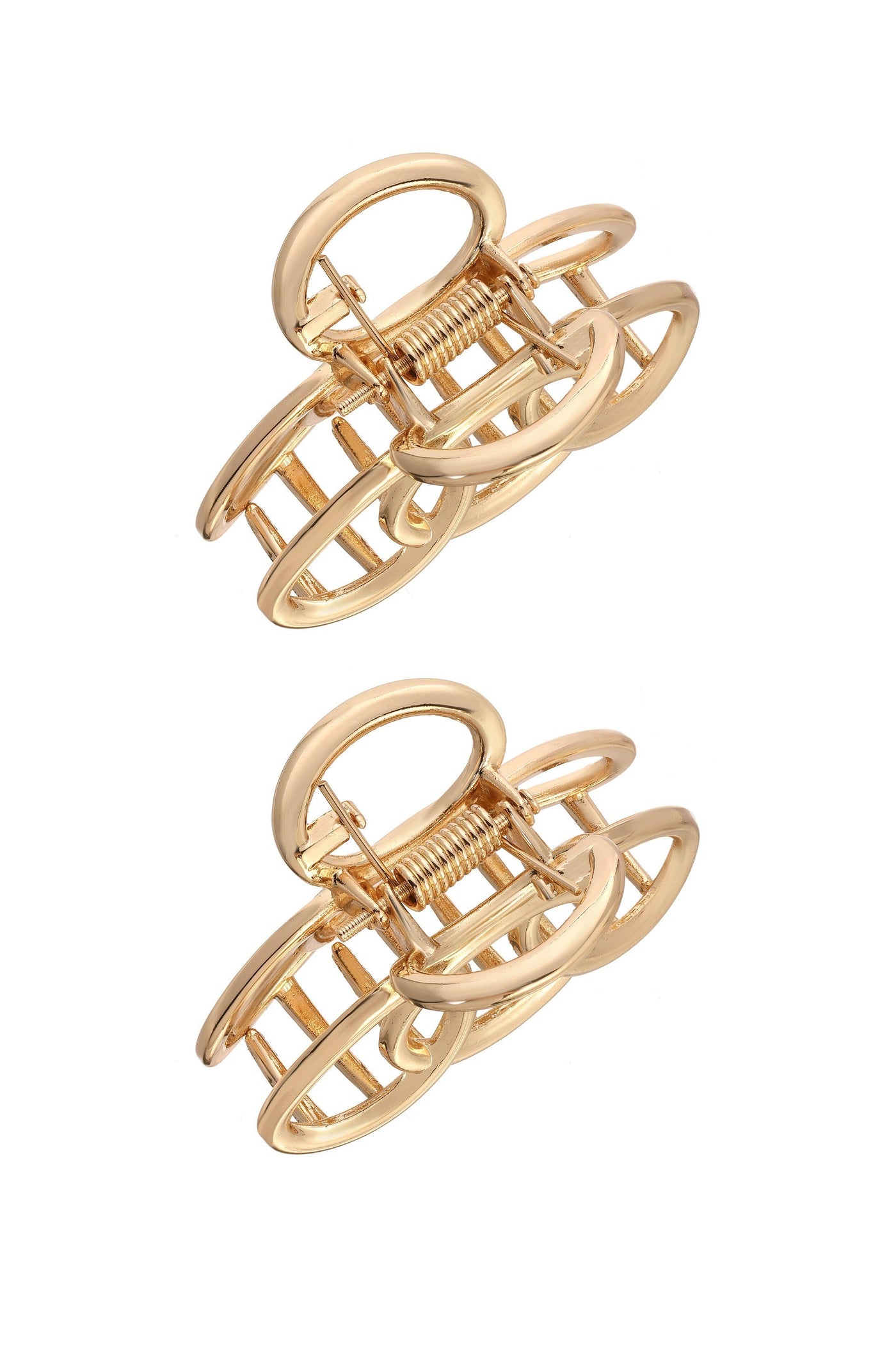 Two gold hair clips are arranged in a stacked position. The clips feature a unique, open oval design with a spring mechanism, set against a plain white background.
