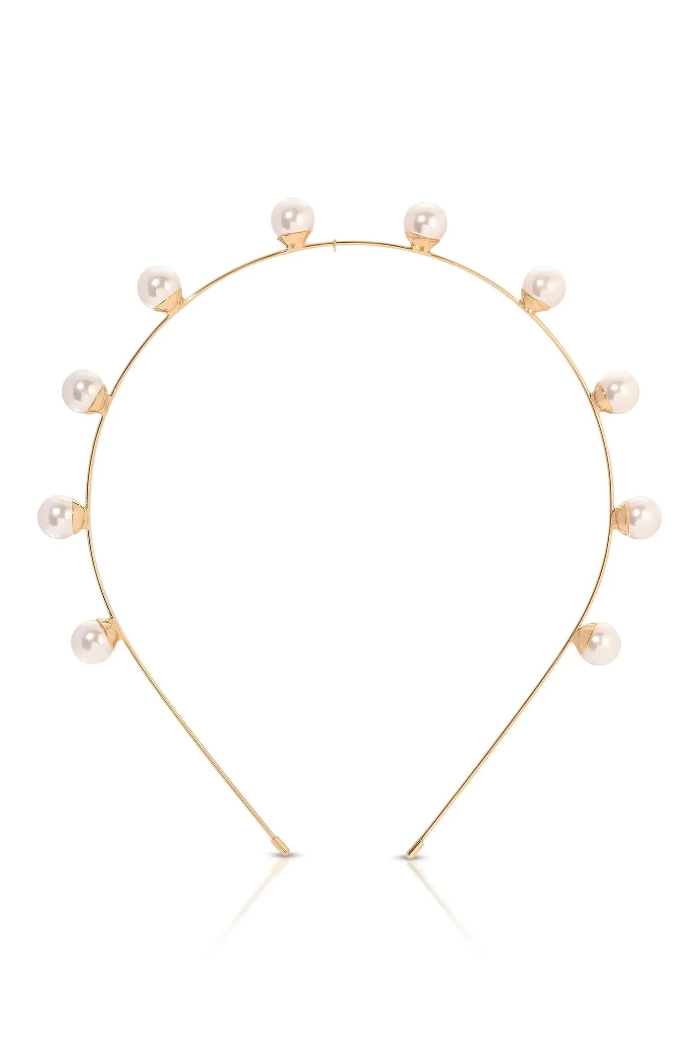 A gold headband features a curved wire adorned with evenly spaced, small pearls. The design is elegant and minimalistic against a plain white background, emphasizing its delicate craftsmanship.