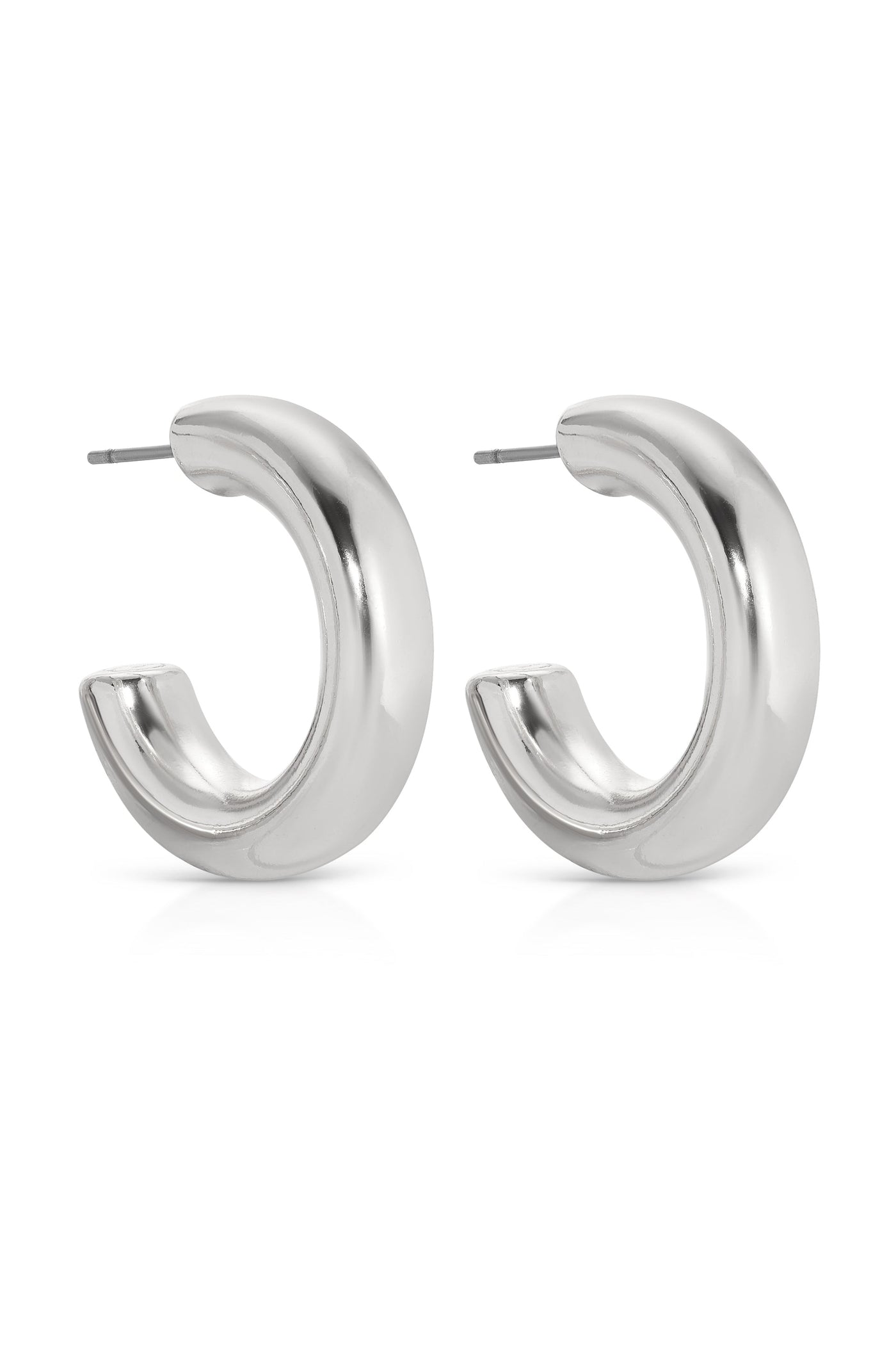 Shiny, silver hoop earrings are displayed side by side, featuring a smooth, curved design. They rest against a plain white background, emphasizing their reflective surface and modern aesthetic.
