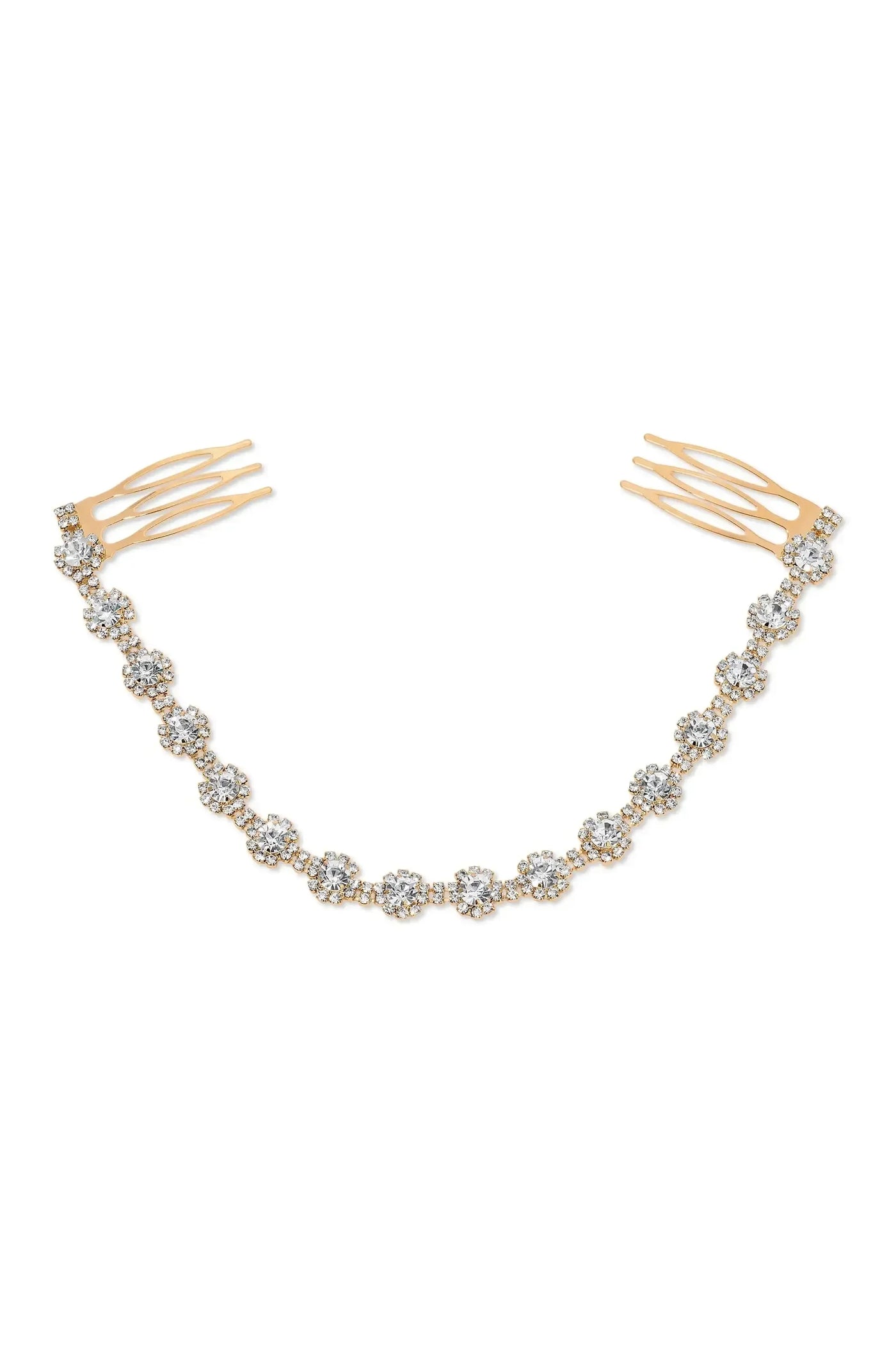 A delicate hair ornament features a series of sparkling rhinestones arranged as flowers, attached to golden comb-like prongs for securing in hair, set against a white background.