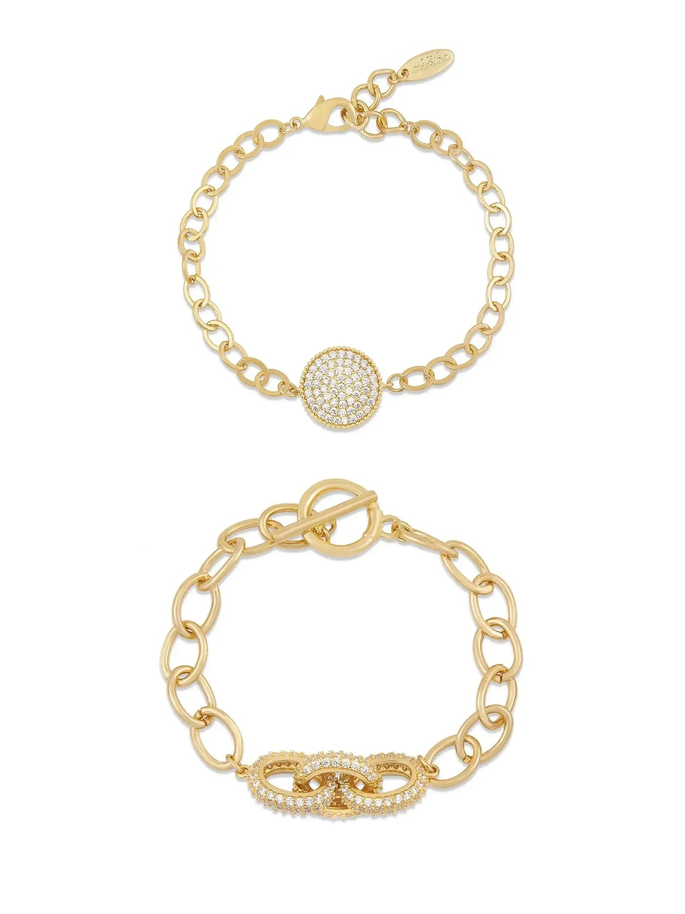 Two gold bracelets are displayed. The top bracelet features a circular centerpiece adorned with small gems, while the bottom bracelet has a decorative clasp with an infinity design, embellished with gems.