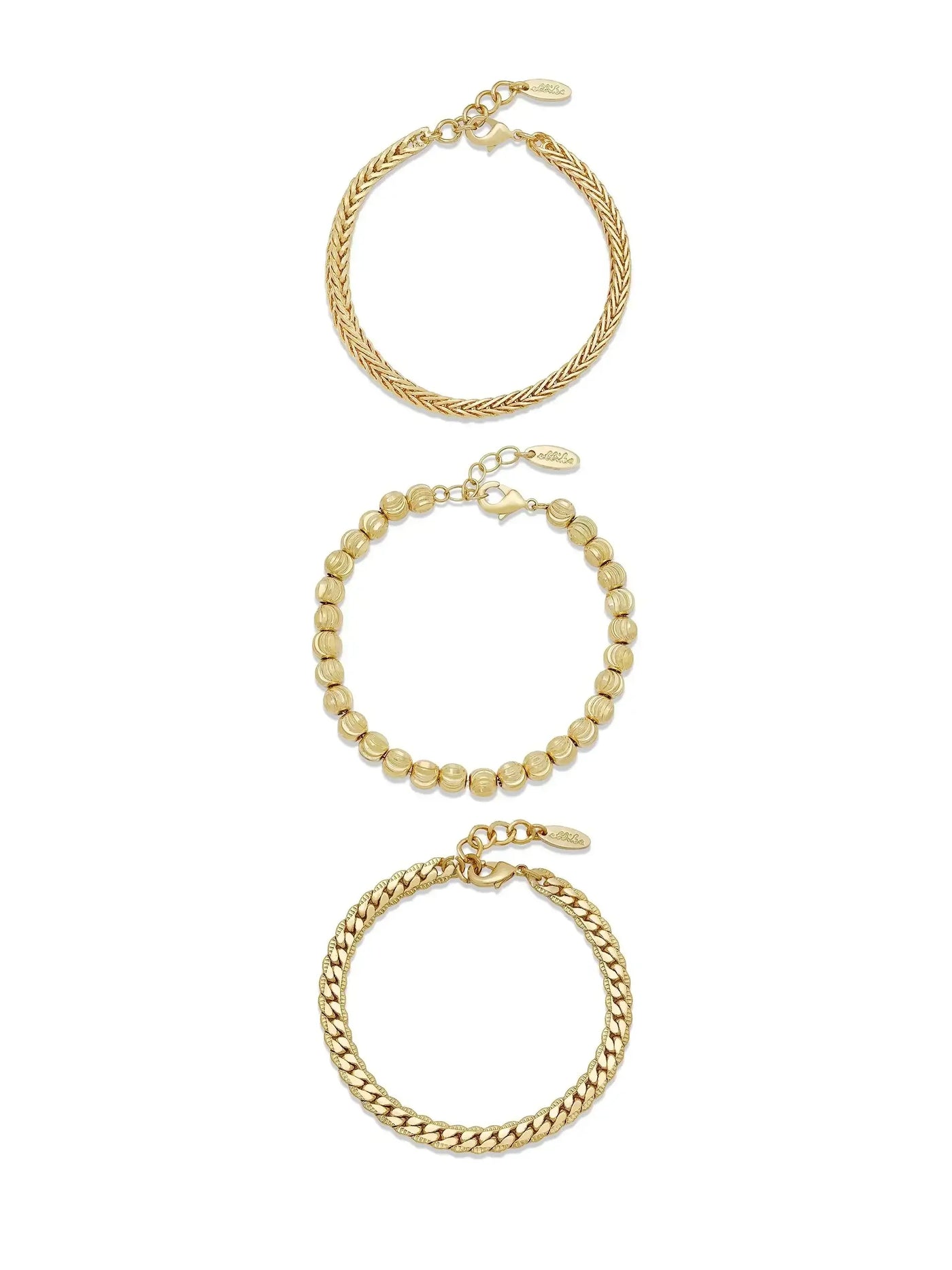 Three gold bracelets are displayed vertically. The top features a twisted design, the middle consists of round beads, and the bottom has a braided structure. They are linked by a chain.
